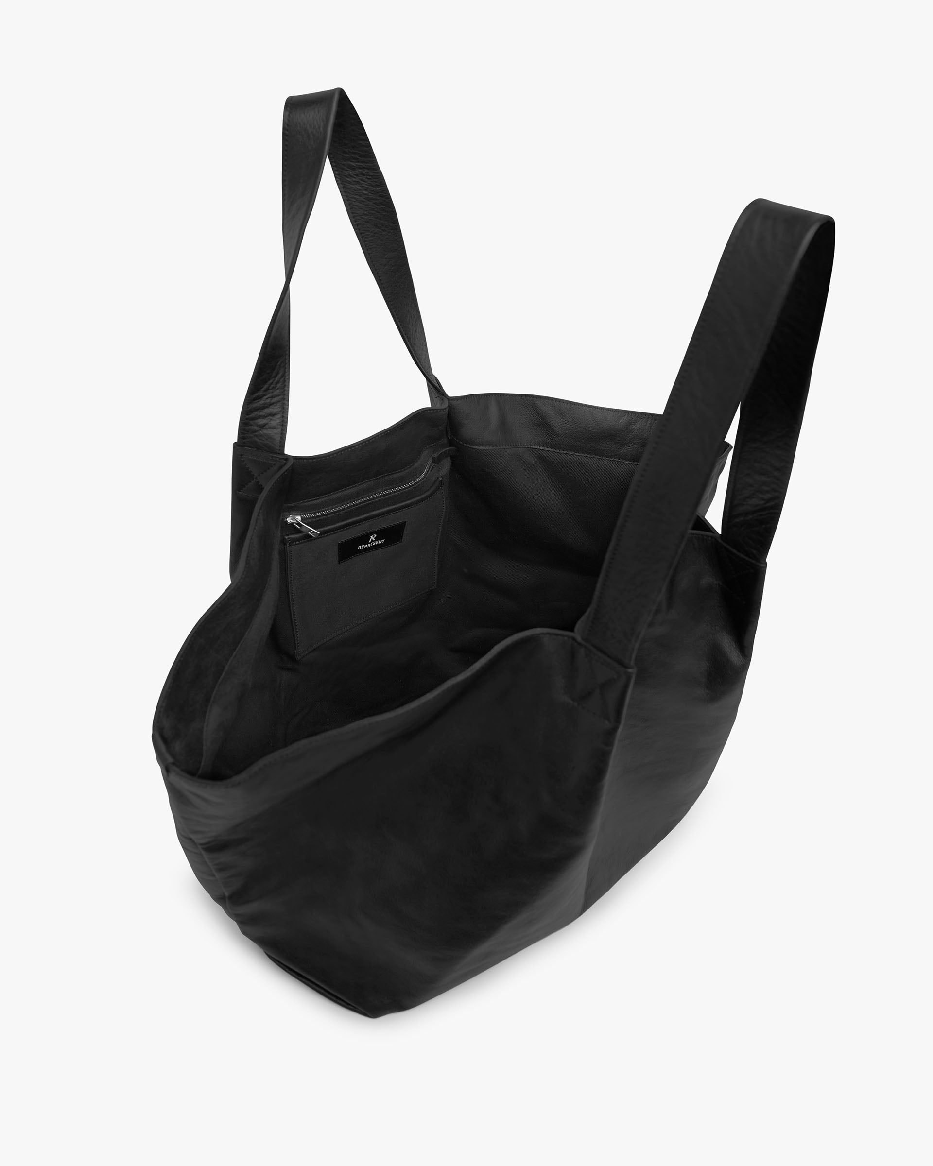 Back product image of a womens black tote bag on a plain white background | Leather Pleat Large Tote in Jet Black | Large tote bag with internal zip pocket | SS25 Accessories | Represent Clo