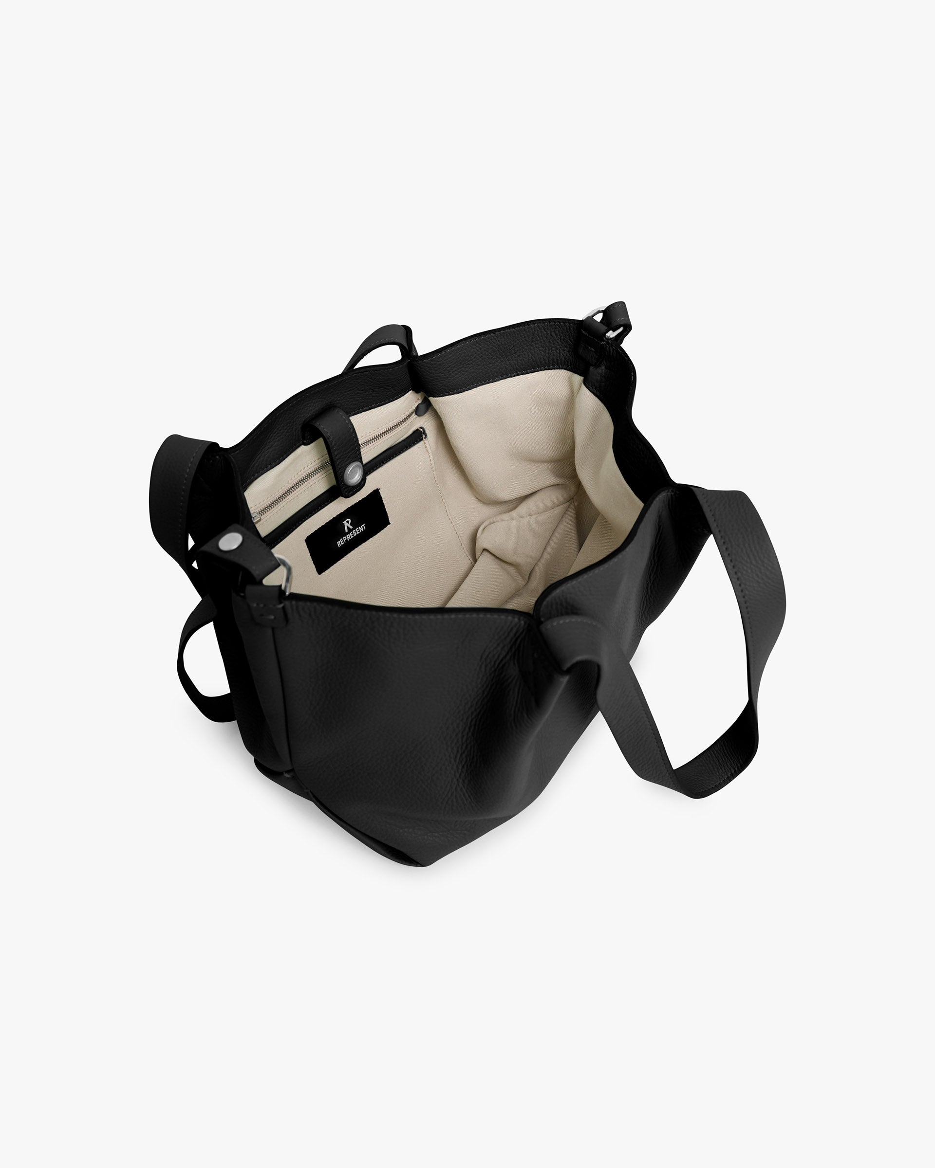 Back product image of a womens black leather tote bag on a plain white background | Leather Pleat Mini Tote in Jet Black | Mini tote with tumbled full grain leather and detachable shoulder strap | SS25 Accessories | Represent Clo