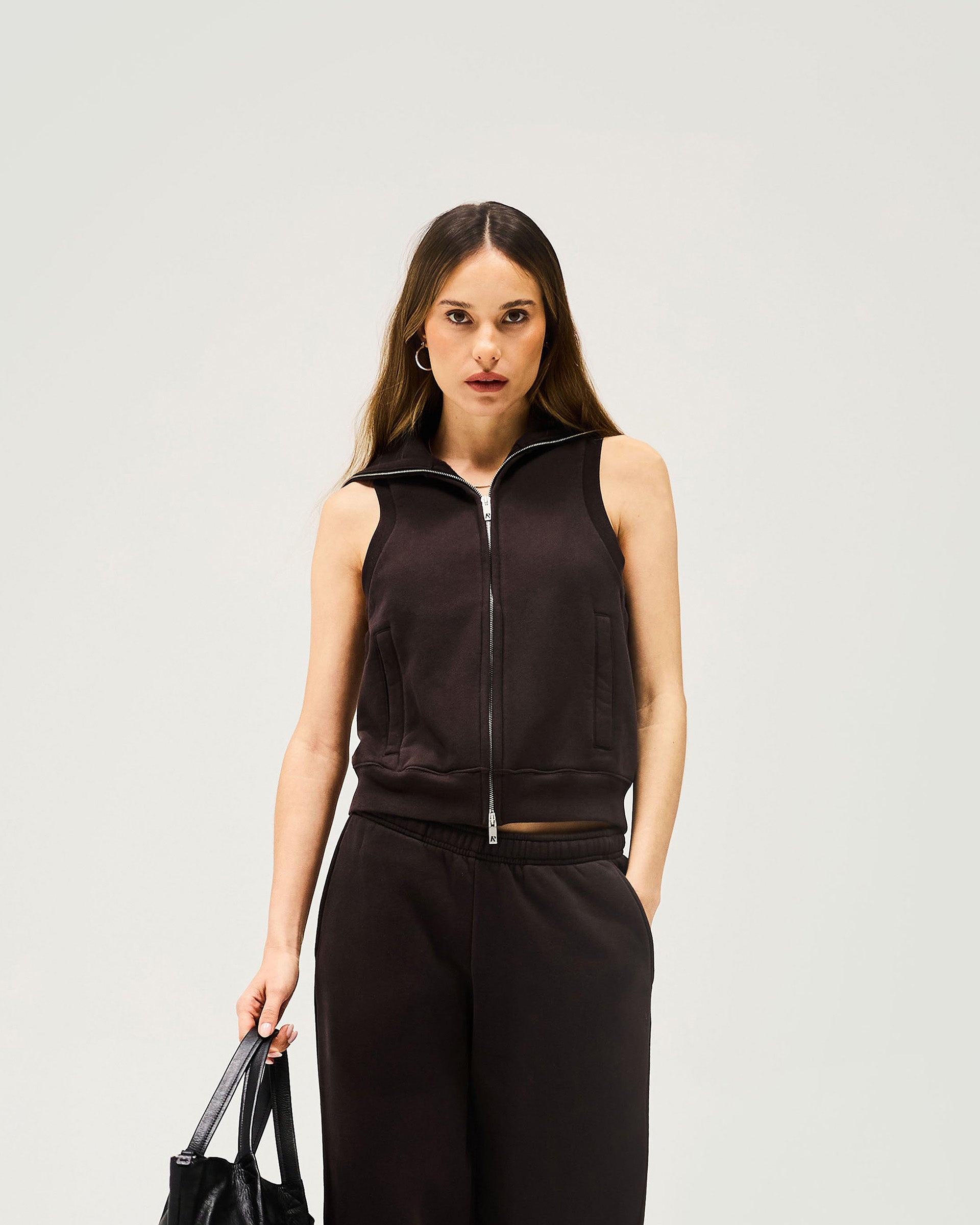 Back product image of a womens black gilet on a plain white background | Owners Club Gilet in Black Coffee | Gilet with double ended metal zipper and side welt pockets | Womens Outerwear | Represent Clo