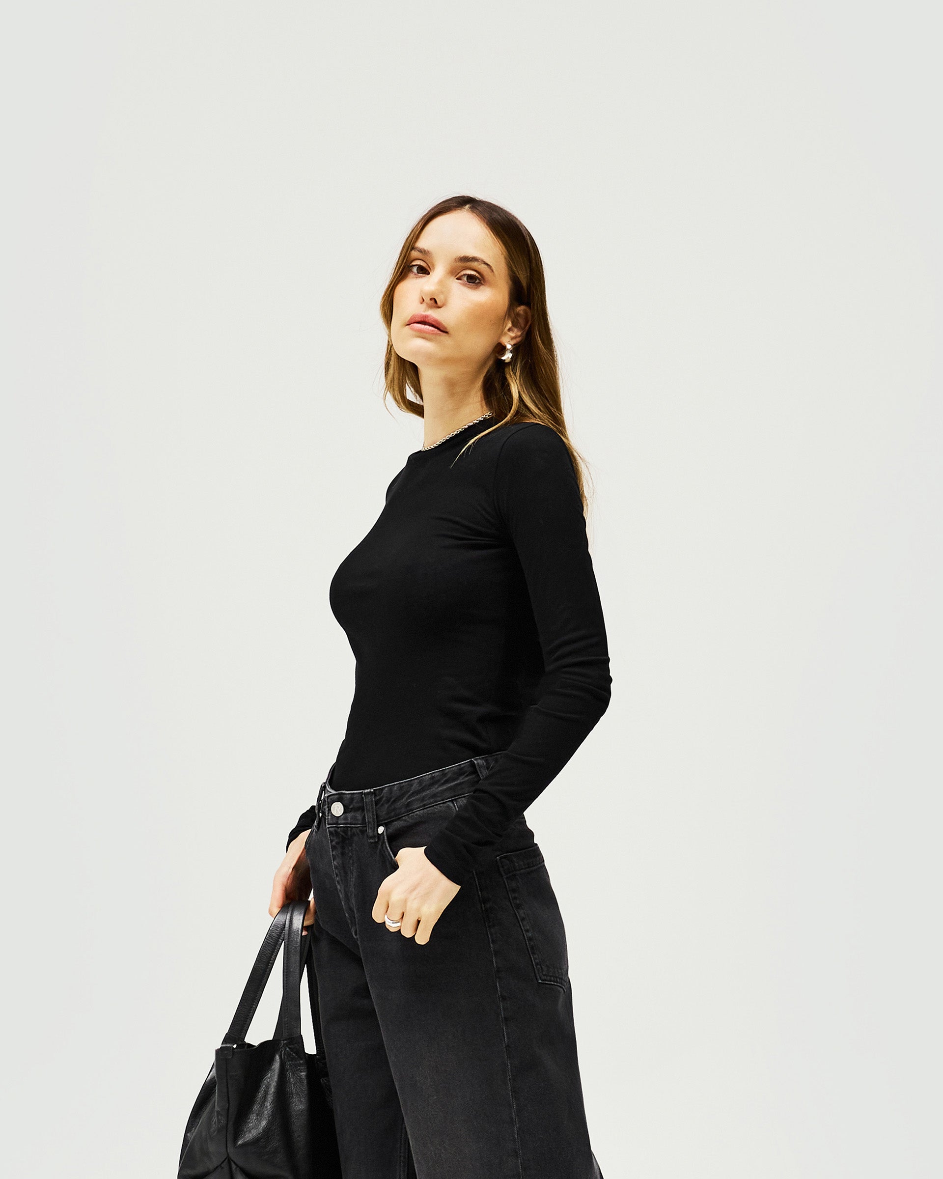 Back product image of a womens black long sleeve tee on a plain white background | Trigger Long Sleeve in Black | Slim fit long sleeve cotton knitwear | Womens SS25 Knitwear | Represent Clo