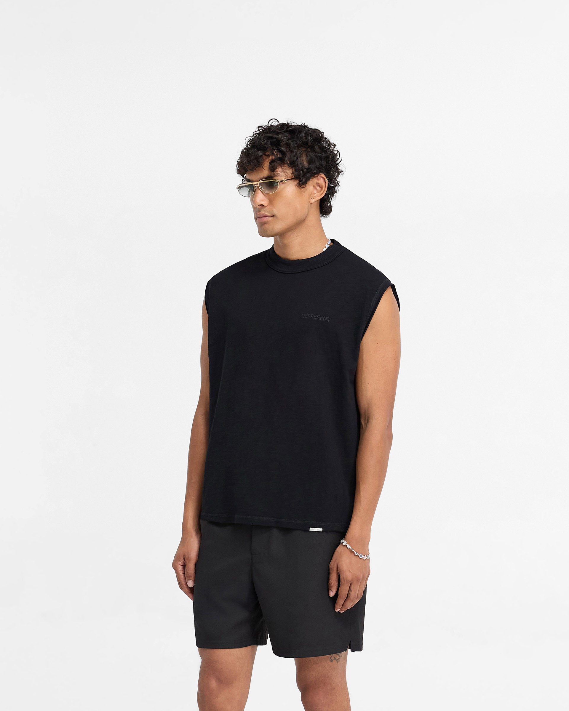 Back product image of a mens black tank top on a plain white background | Slub Tank in Jet Black | Oversized fit tank top with tonal embroidery | FW24 T-Shirts | Represent Clo