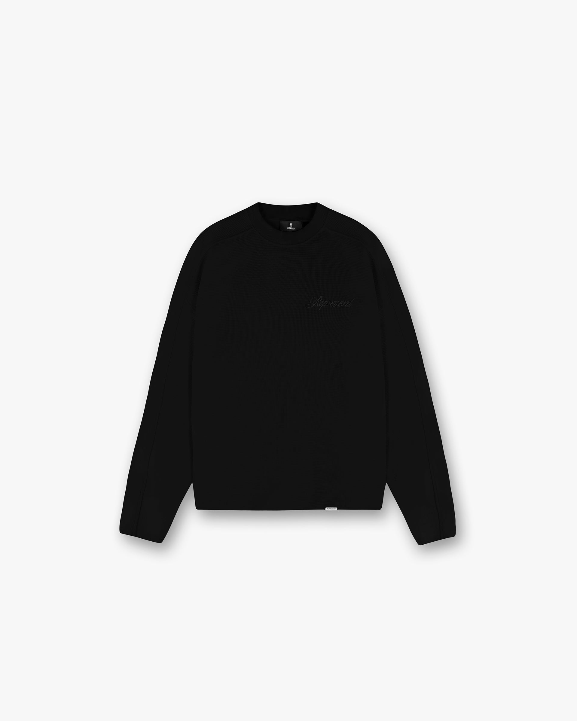 Front product image of a mens black long sleeve t-shirt on a plain white background | Waffle Long Sleeve T-Shirt in Black | Recycled nylon long sleeve t-shirt | SS25 T-Shirts | Represent Clo