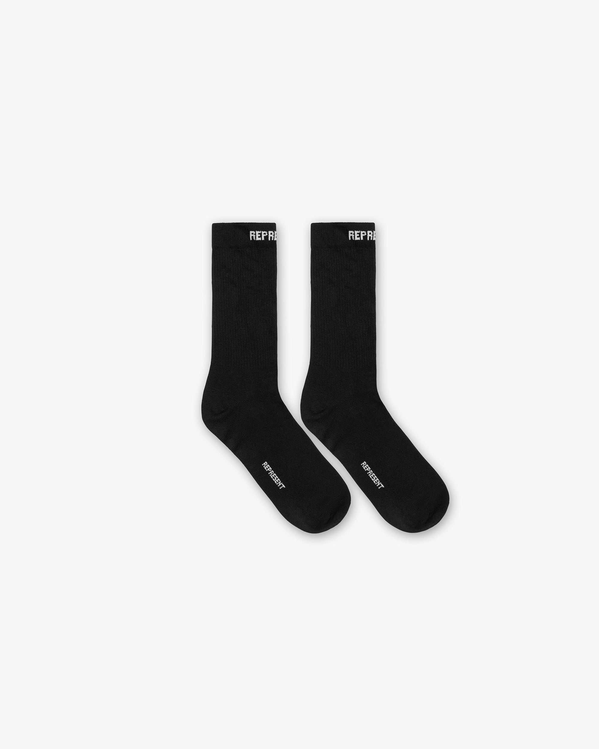 Front product image of a mens black and white sock on a plain white background | Core Sock in Black | Comfortable premium cotton accessory | FW23 Accessories | Represent Clo