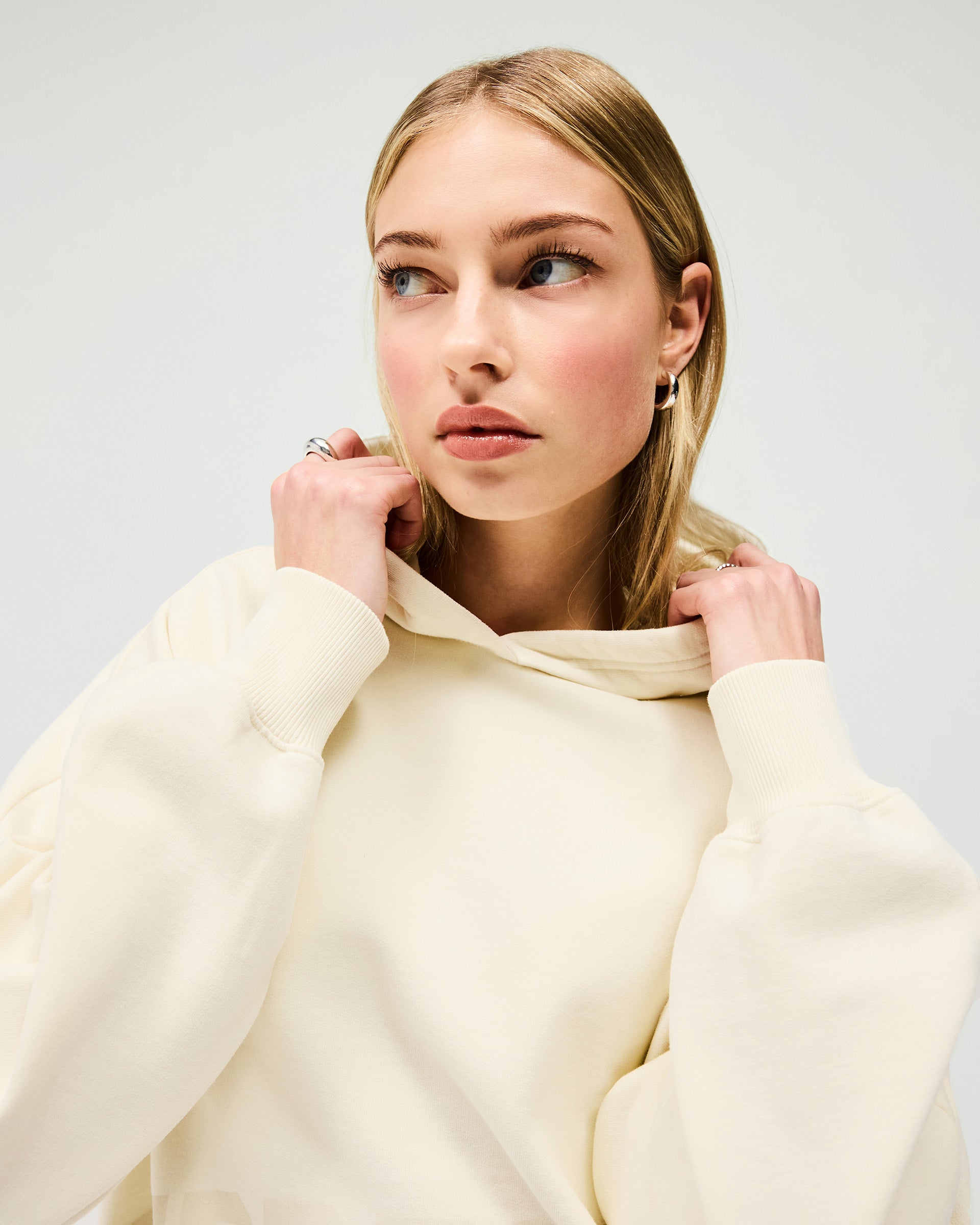 Back product image of a womens cream hoodie on a plain white background | Boyfriend Graphic Hoodie in Cream | Oversized hoodie with ribbed hem and cuffs | Womens SS25 Hoodies | Represent Clo