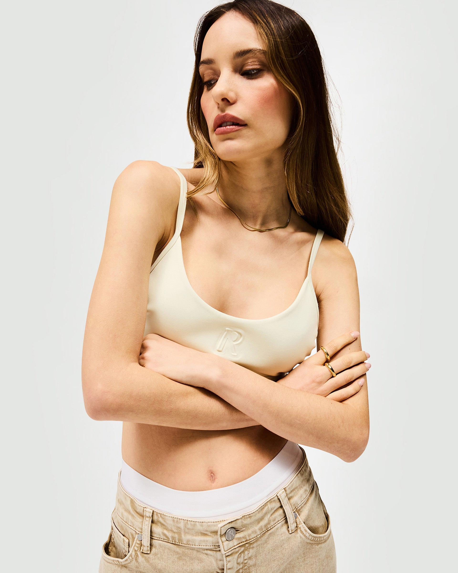 Back product image of a womens white bralette on a plain white background | Control Bralette in Warm White | Bralette top with adjustable fit and Initial R detail | SS25 Tops | Represent Clo