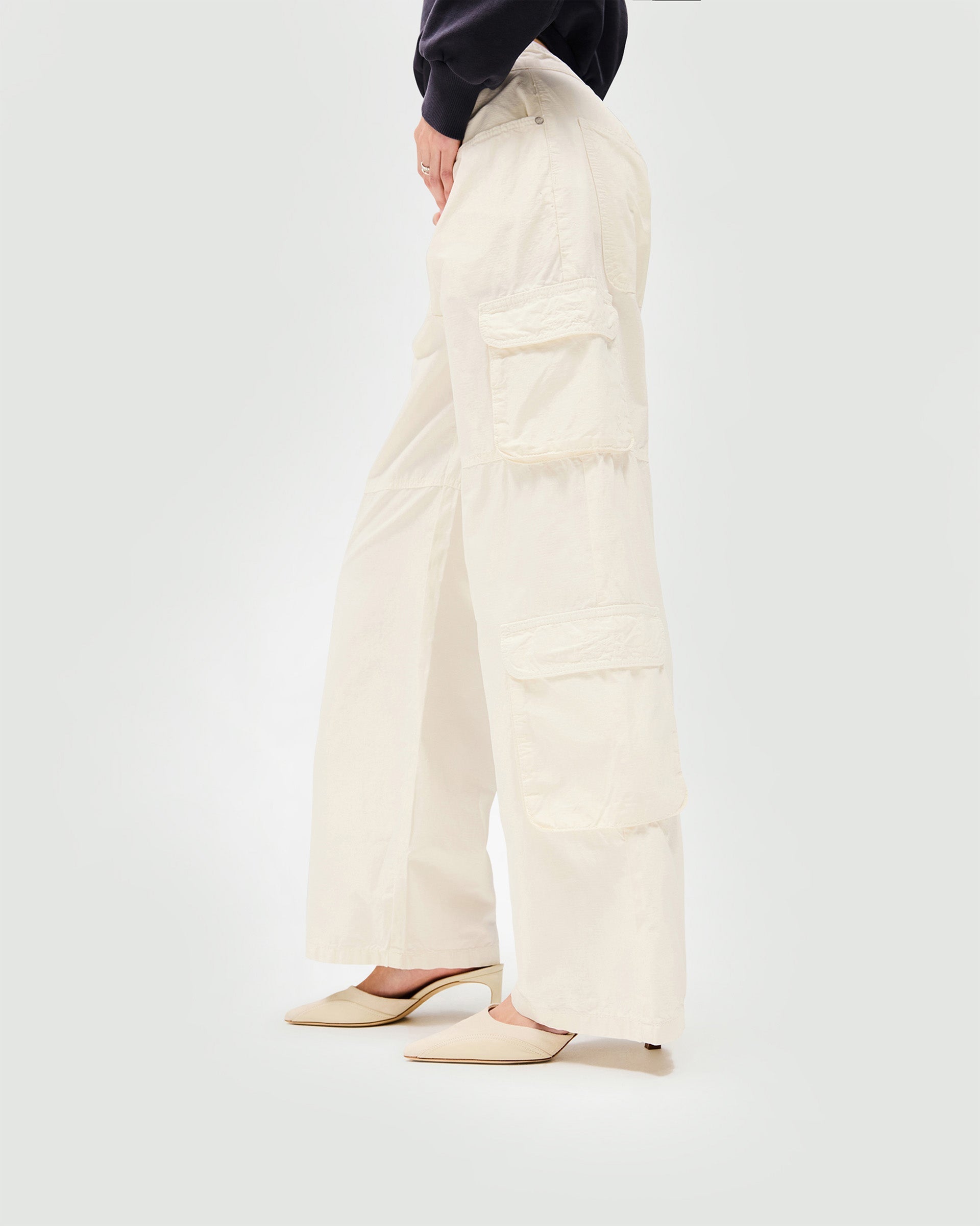 Back product image of a womens white cargo trousers on a plain white background | Fender Cargo in Antique White | Wide leg cargo trousers with fitted waist and ripstop cotton | SS25 Bottoms | Represent Clo