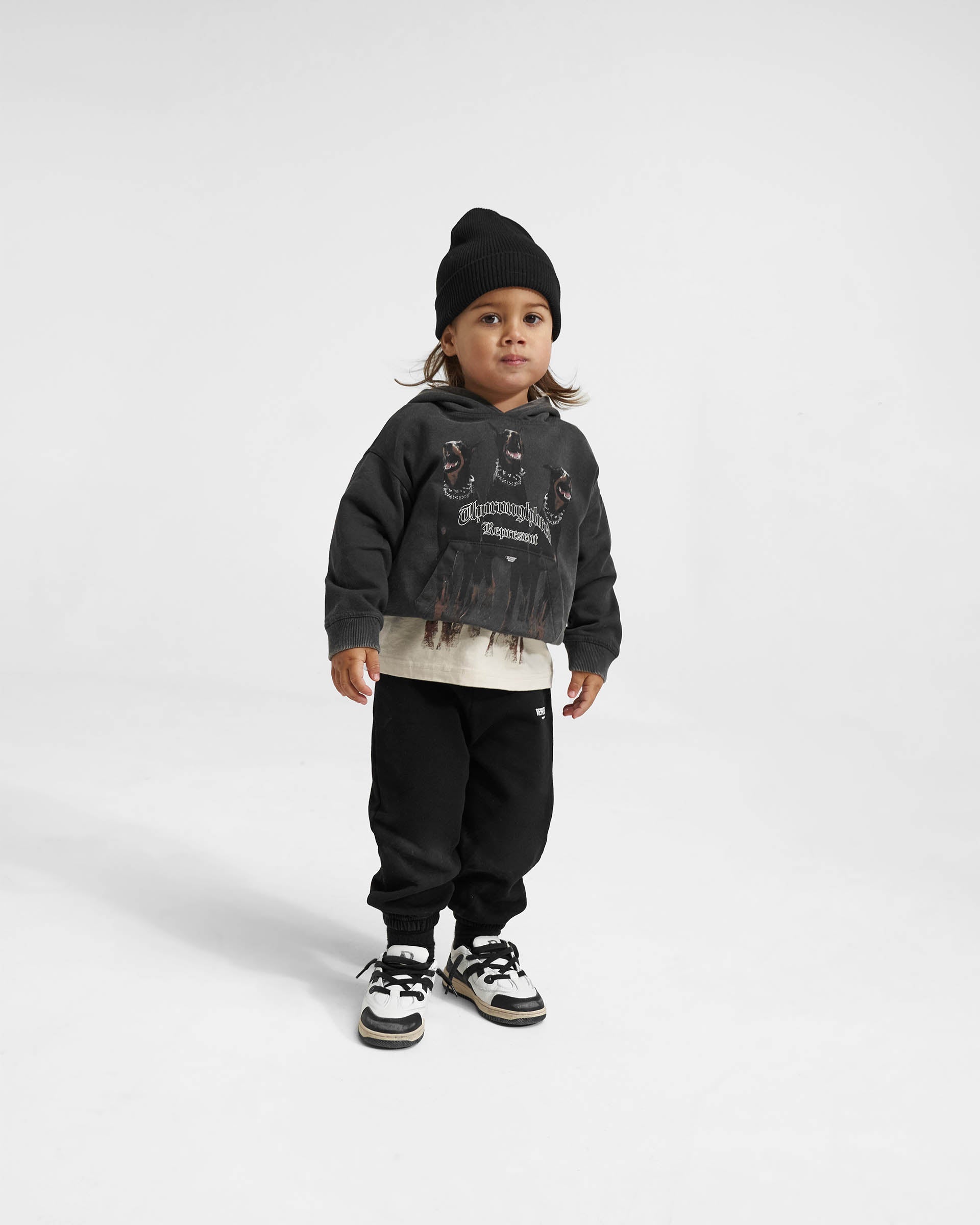 Back product image of a childs black hoodie on a plain white background | Mini Thoroughbred Hoodie in Vintage Black | Oversized kids hoodie with screen printed graphic | Mini Hoodies | Represent Clo