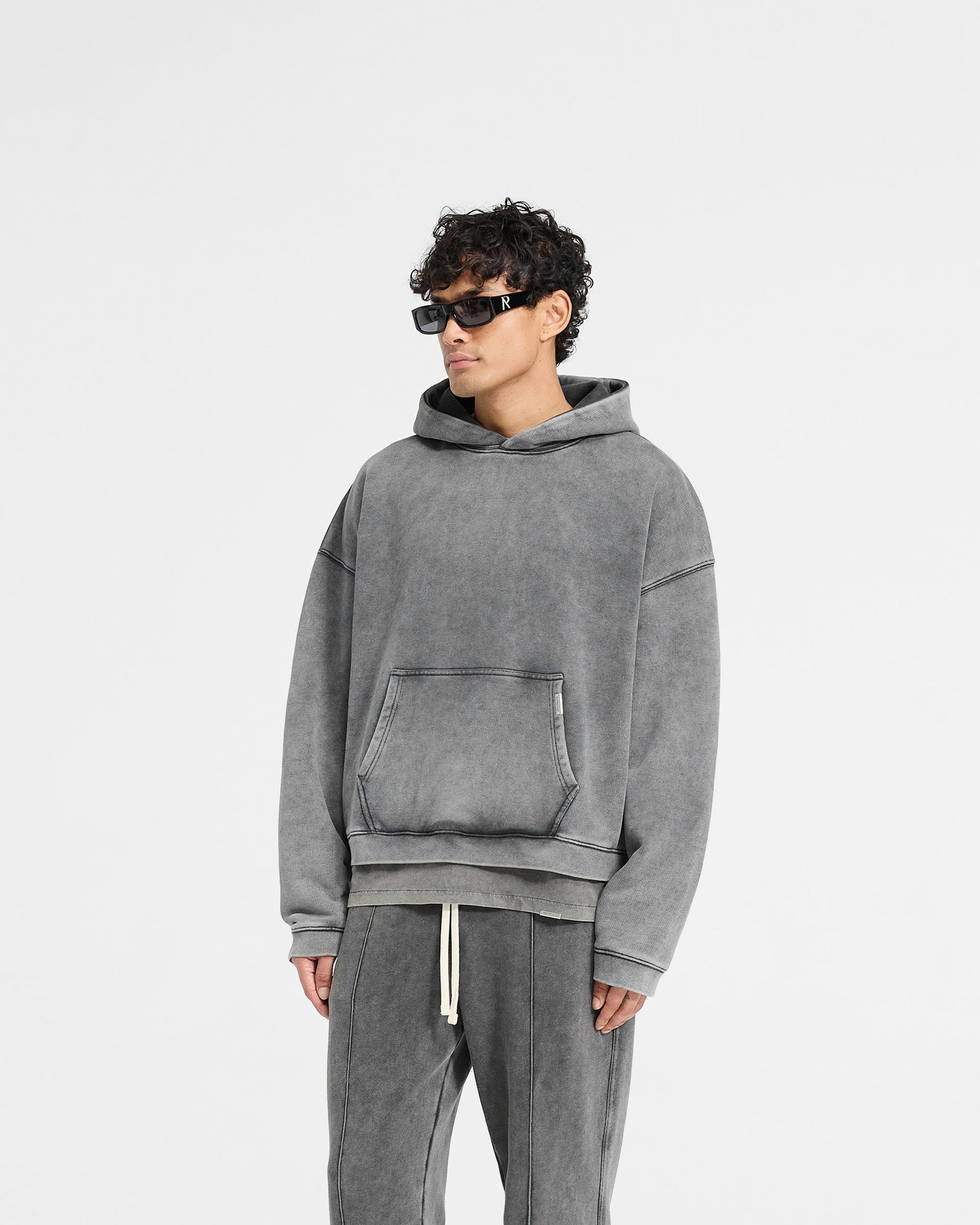 Back product image of a mens grey hoodie on a plain white background | Initial Boxy Hoodie in Vintage Grey | Oversized boxy fit with cropped body and embroidered initial | Initial Hoodies | Represent Clo
