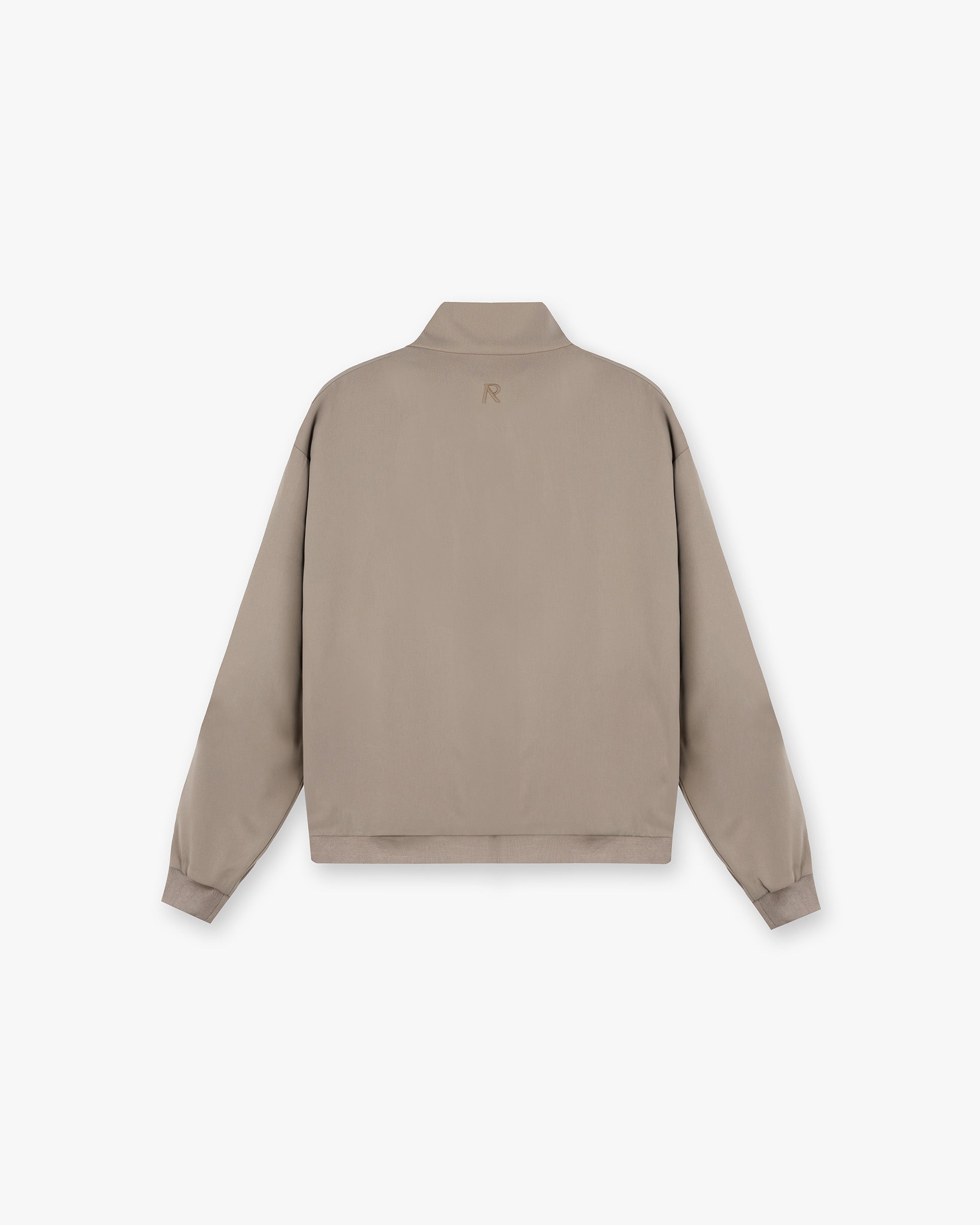 Back product image of a mens beige track jacket on a plain white background | Initial Track Jacket in Dune | Oversized fit track jacket with double-ended zip and welt pockets | Initial Outerwear | Represent Clo