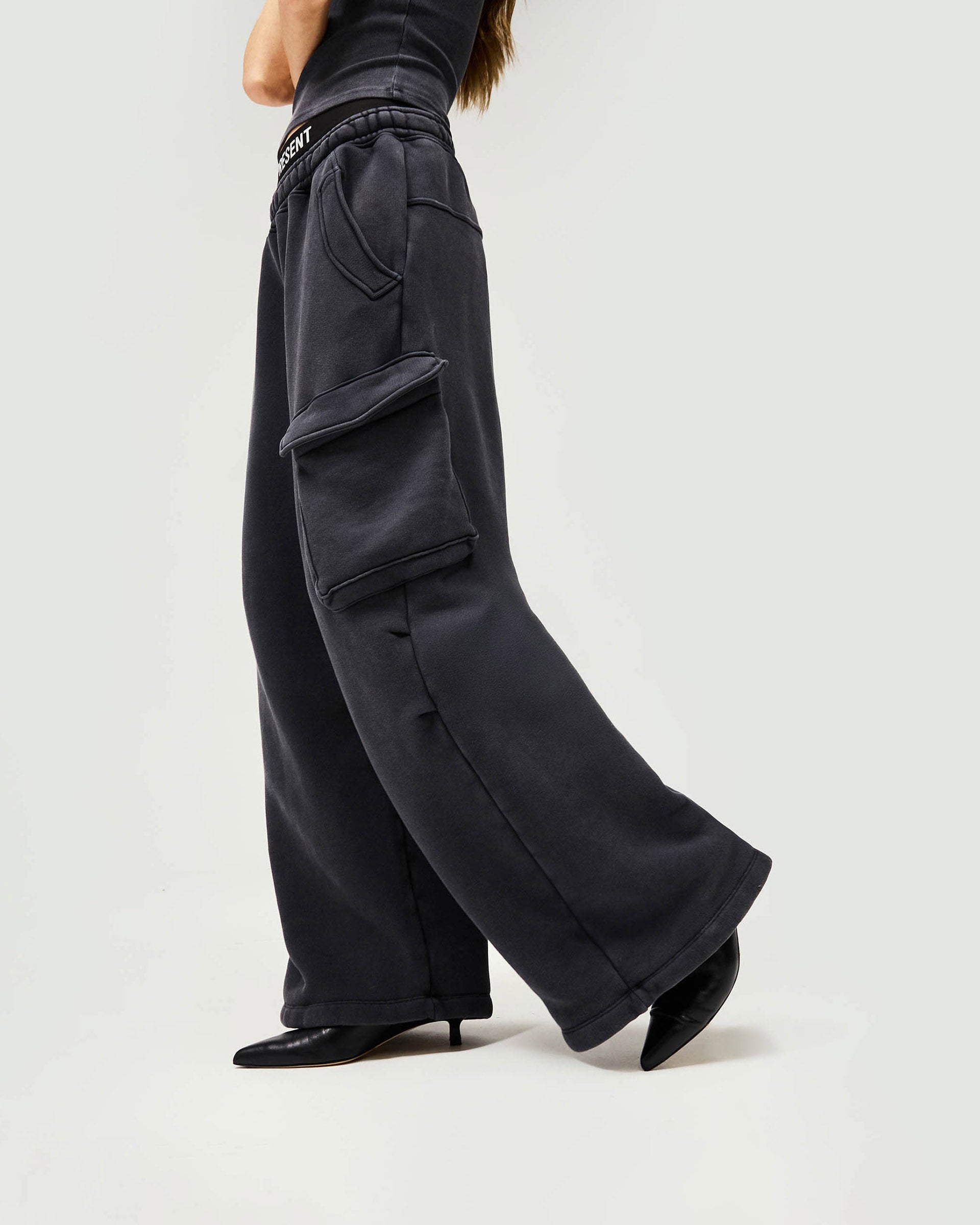 Back product image of a womens black jogger on a plain white background | Initial Cargo Jogger in Washed Black | Sweat trousers with patch pockets | Womens Initial Bottoms | Represent Clo