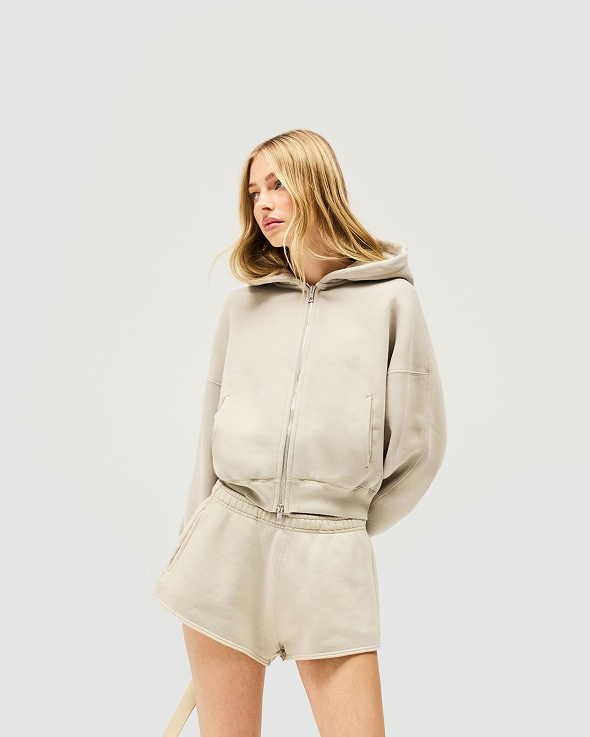 Back product image of a womens grey hoodie on a plain white background | Initial Oversized Crop Hoodie in Storm | Cropped fit heavyweight cotton hoodie with raglan seams | Womens Initial Hoodies | Represent Clo