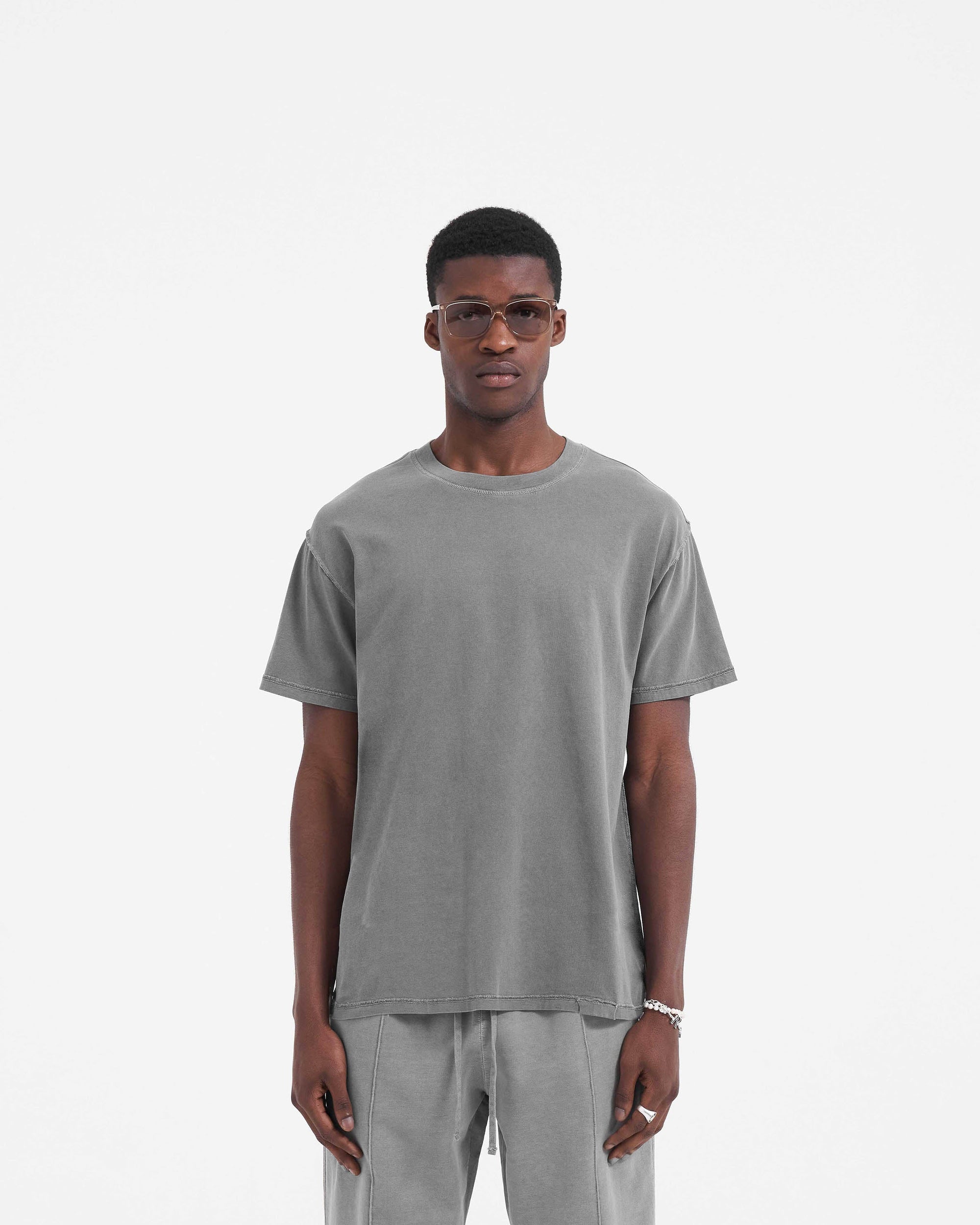 Back product image of a mens grey t-shirt on a plain white background | Initial T-Shirt in Ultimate Grey | Boxy fit t-shirt with external overlock seams | Initial T-Shirts | Represent Clo