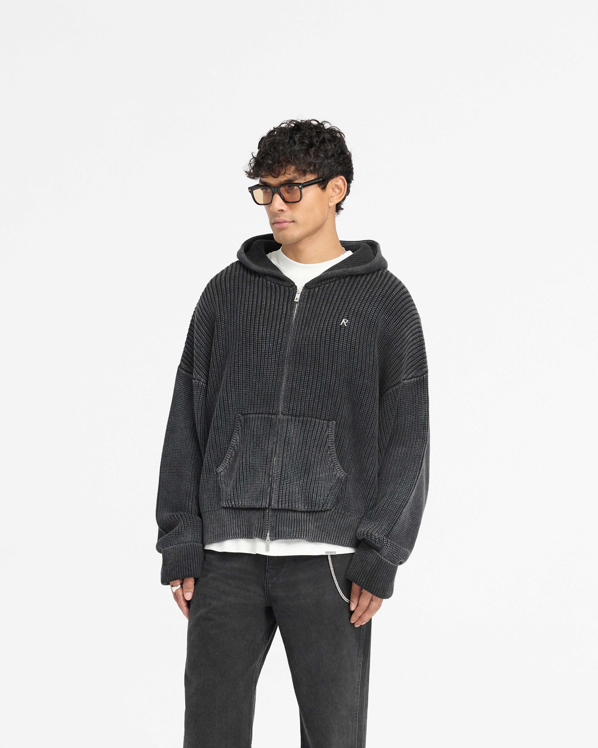 Back product image of a mens black hoodie on a plain white background | Ribbed Zip Through Hoodie in Jet Black | Oversized boxy fit chunky knit hoodie | PRE SS25 Knitwear | Represent Clo