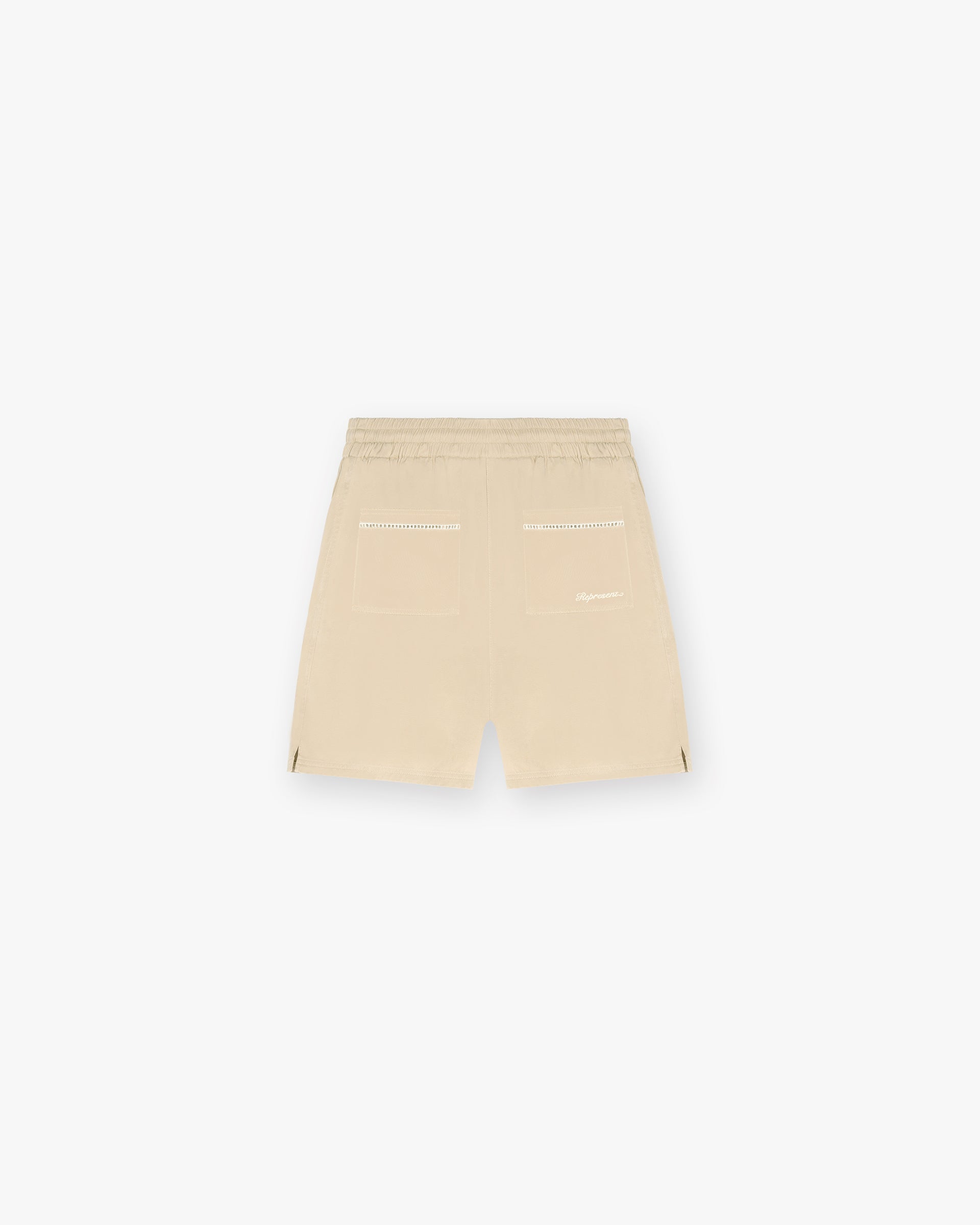 Back product image of mens brown shorts on a plain white background | Resort Shorts in Latte | Relaxed fit drapey shorts with elasticated waistband | SC24 Shorts | Represent Clo
