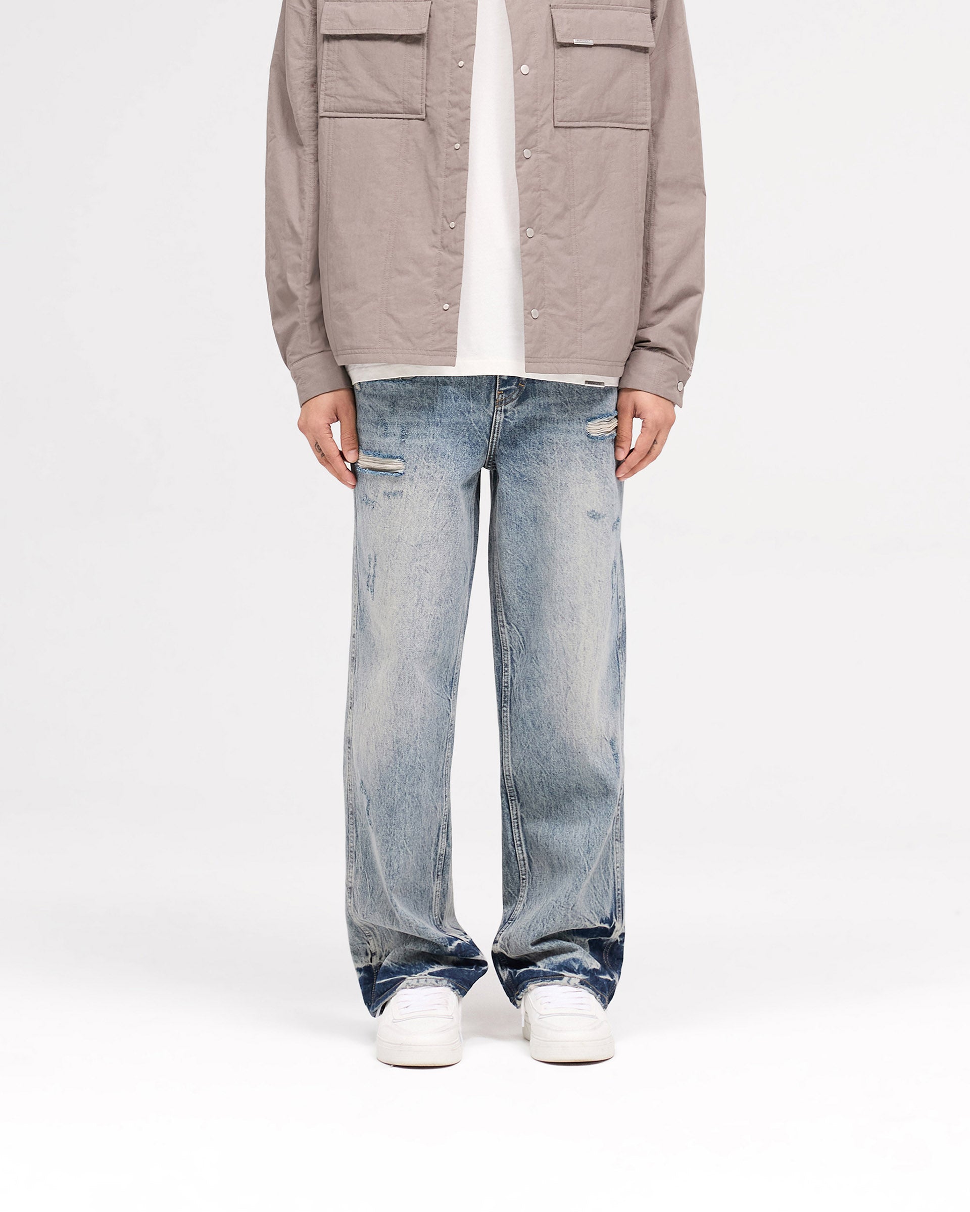 Back product image of mens blue denim on a plain white background | R3 Distressed Baggy Denim in Blue Cream | Baggy fit denim with ripped details and Initial embroidery | SS25 Denim | Represent Clo