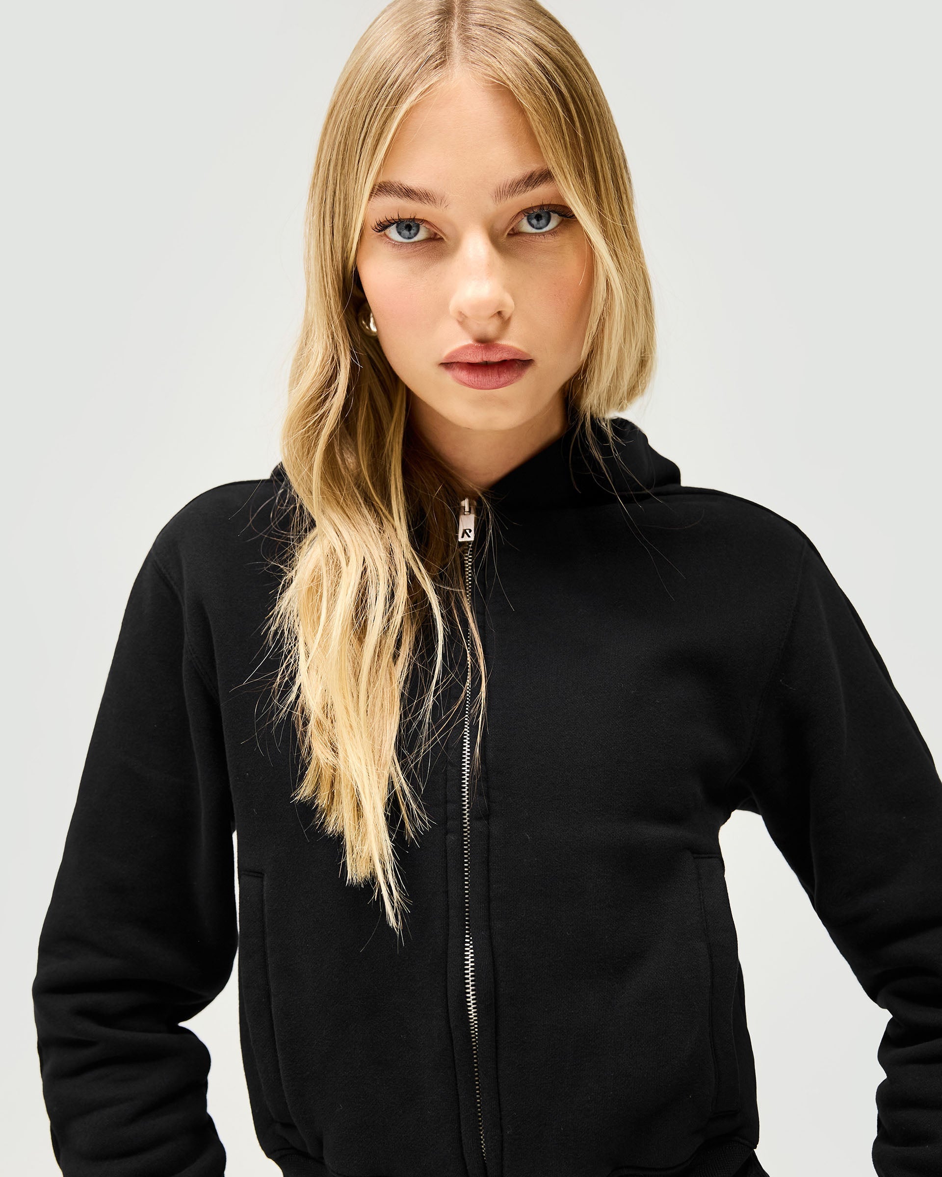 Back product image of a womens black zip hoodie on a plain white background | Owners Club Slim Zip Hoodie in Jet Black | Cropped slim fit zip through hoodie with brushed cotton fleece | Womens Owners Club Hoodies | Represent Clo