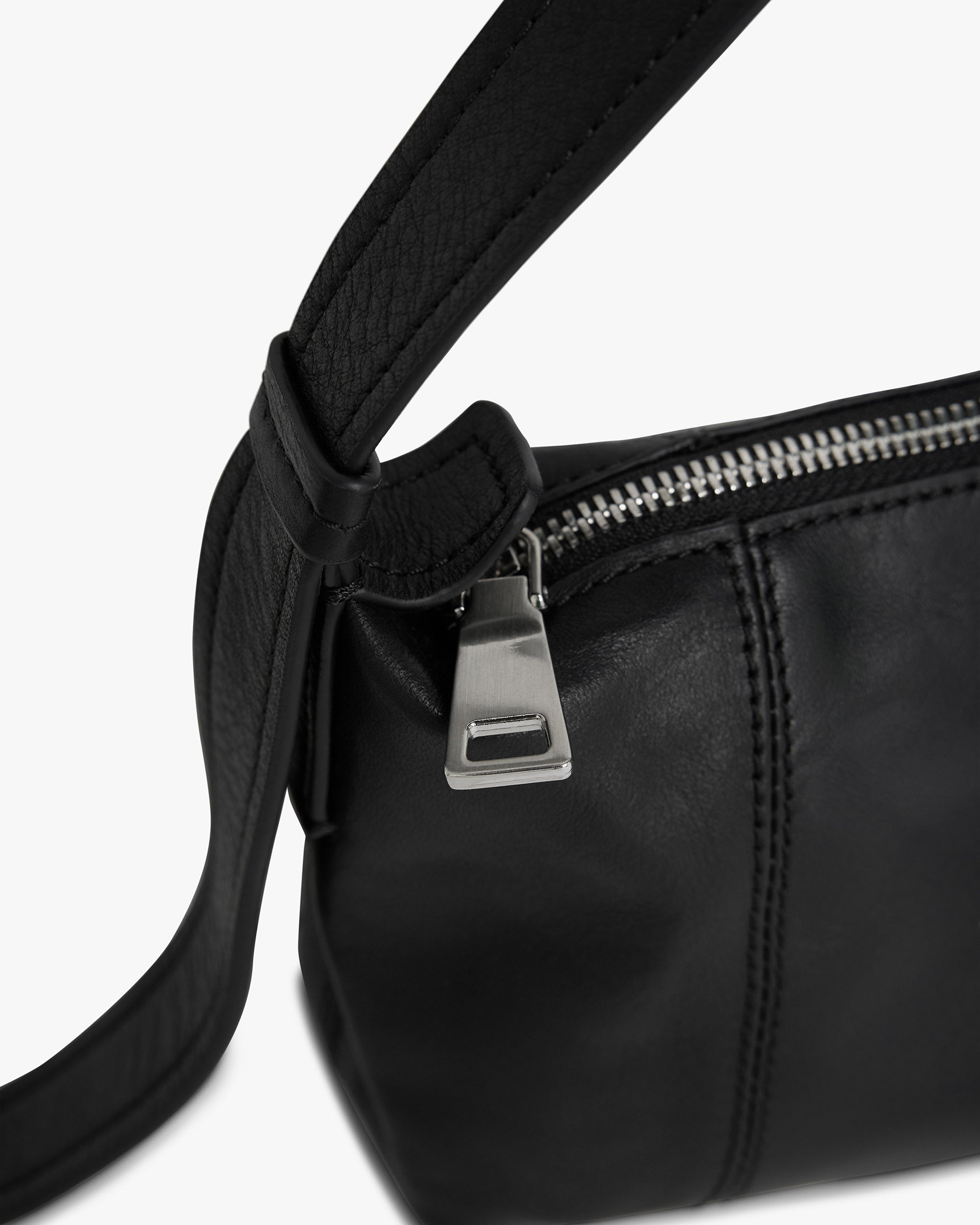 Back product image of a womens black baguette bag on a plain white background | Snap Baguette Bag in Jet Black | Baguette bag with zip fastening and adjustable strap | Womens SS25 Accessories | Represent Clo