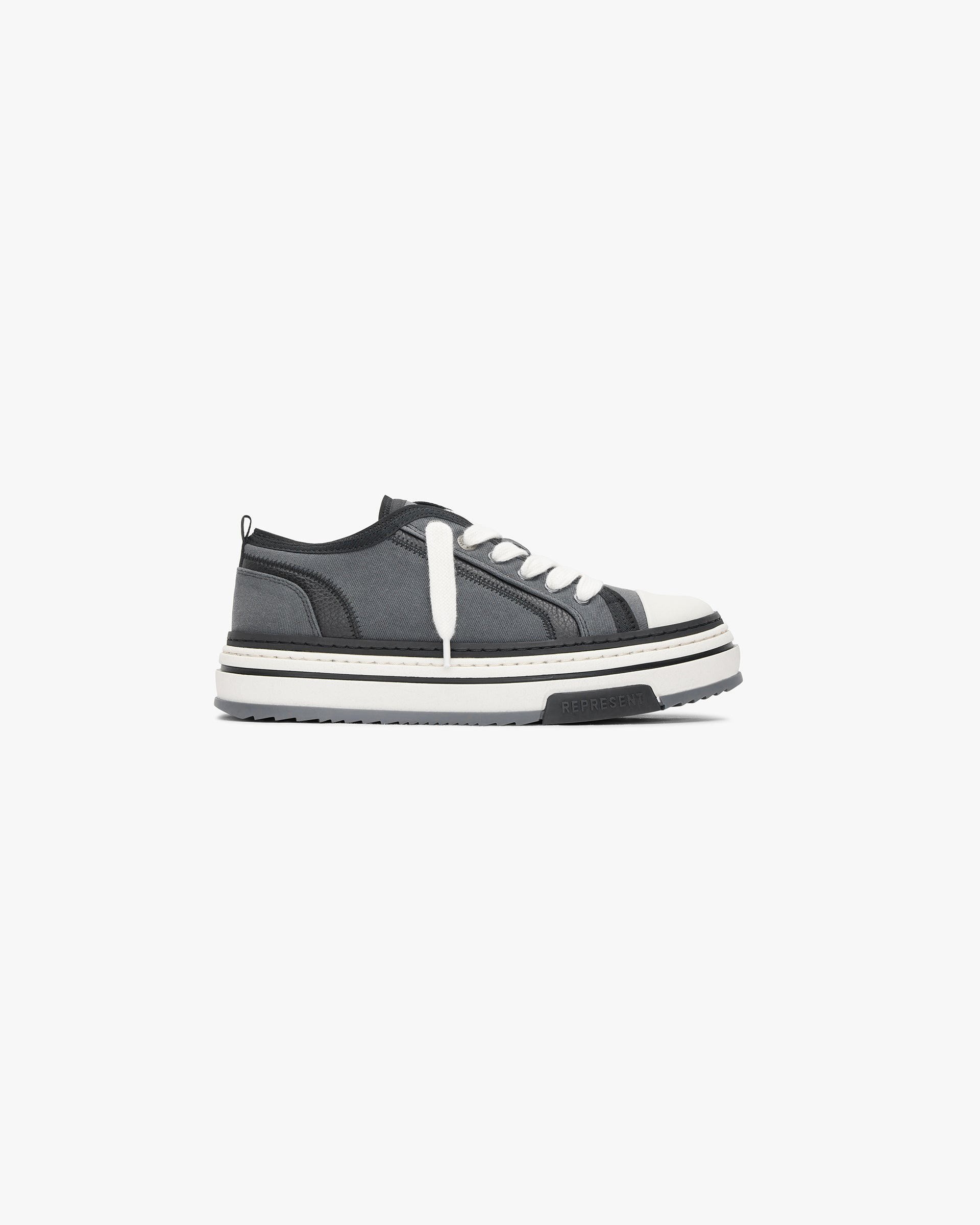 Front product image of a mens black textured low footwear on a plain white background | HTN X Low in Black Textured | Textured footwear | SS24 Footwear | Represent Clo