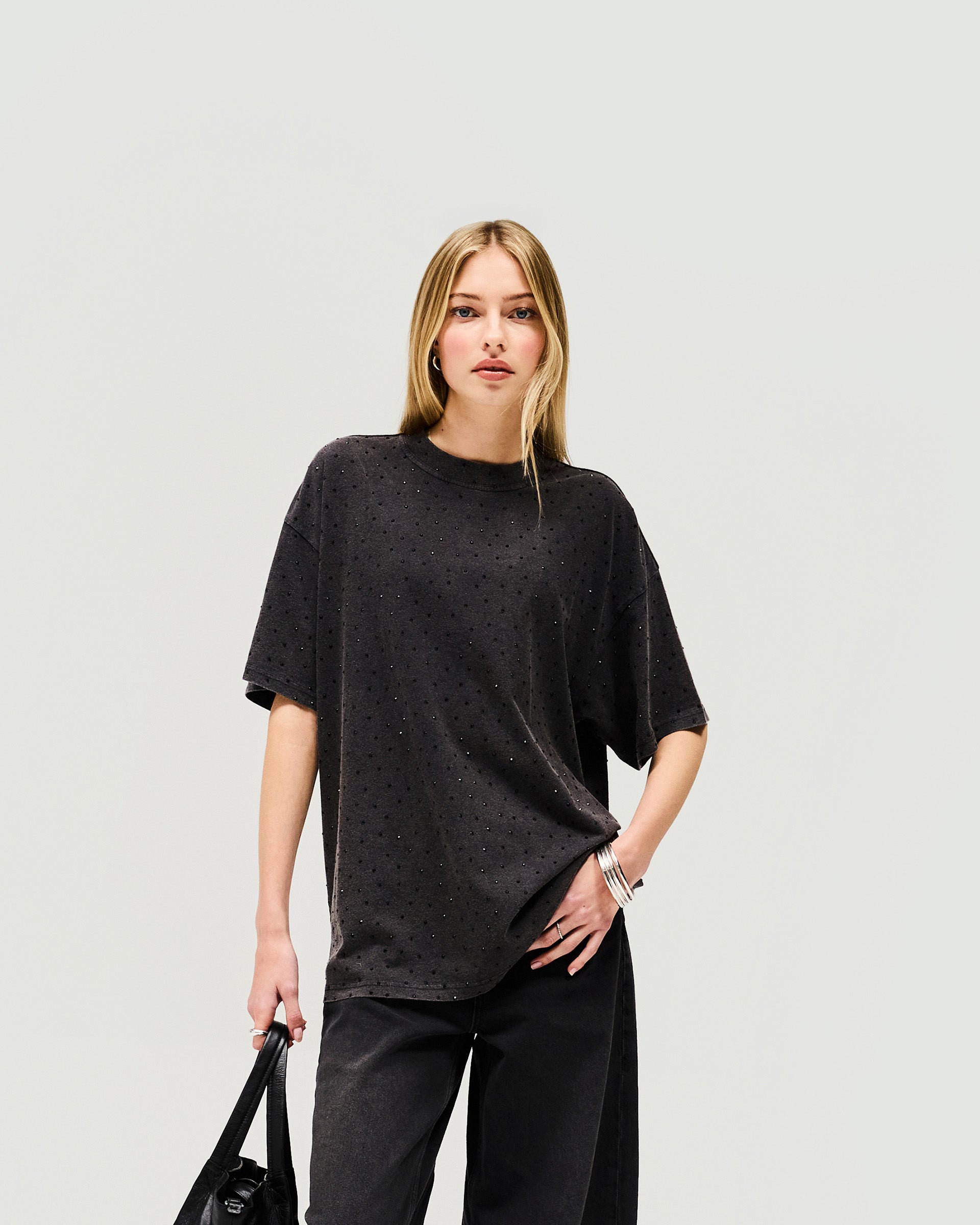 Back product image of a womens grey t-shirt on a plain white background | Spark T-Shirt in Washed Grey | Oversized fit t-shirt with silicon finish and hot fix detail | Womens SS25 Tops | Represent Clo