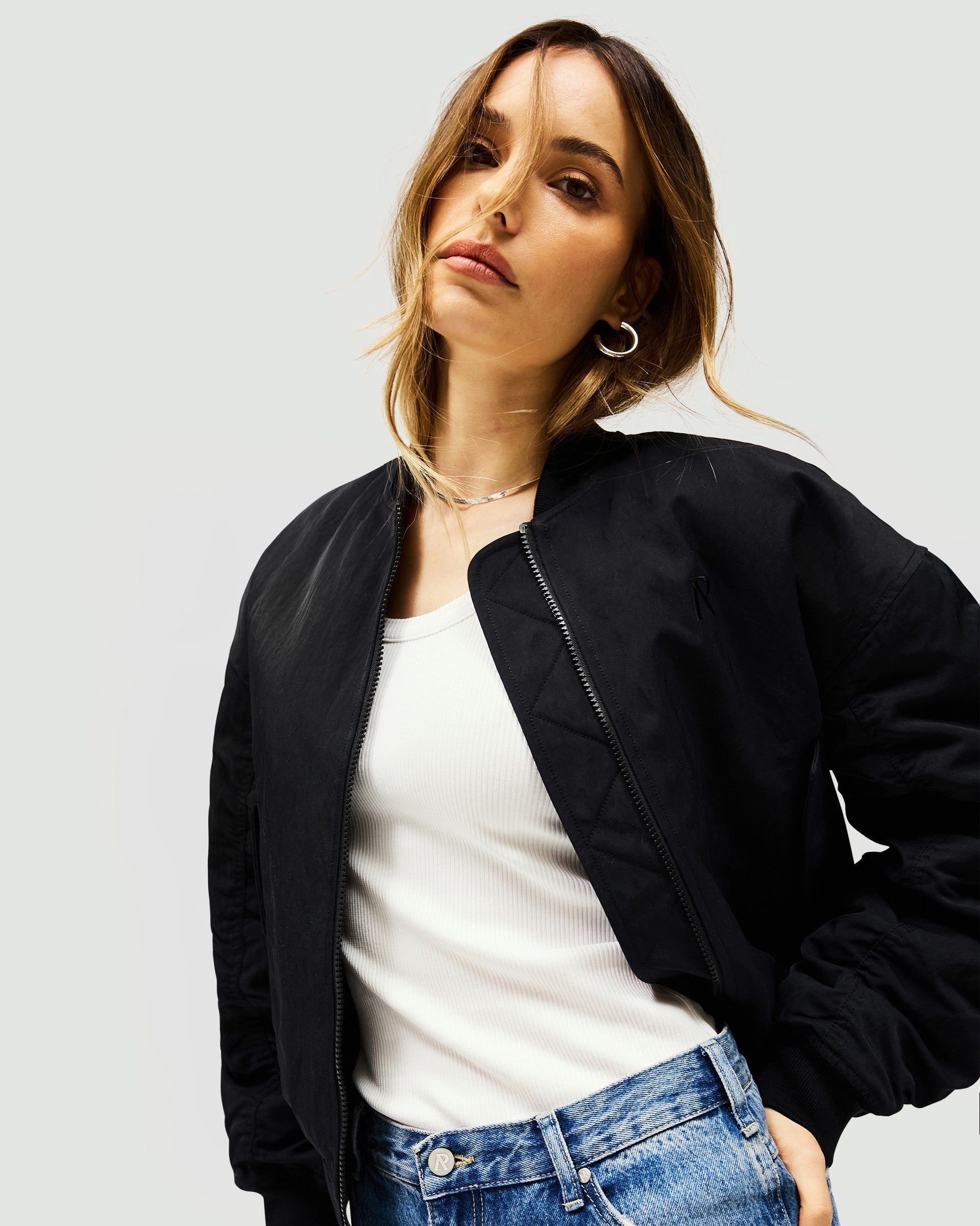 Back product image of a womens black bomber jacket on a plain white background | Subway Jacket in Jet Black | Bomber jacket with embroidered detail and ribbed cuffs | Womens SS25 Outerwear | Represent Clo