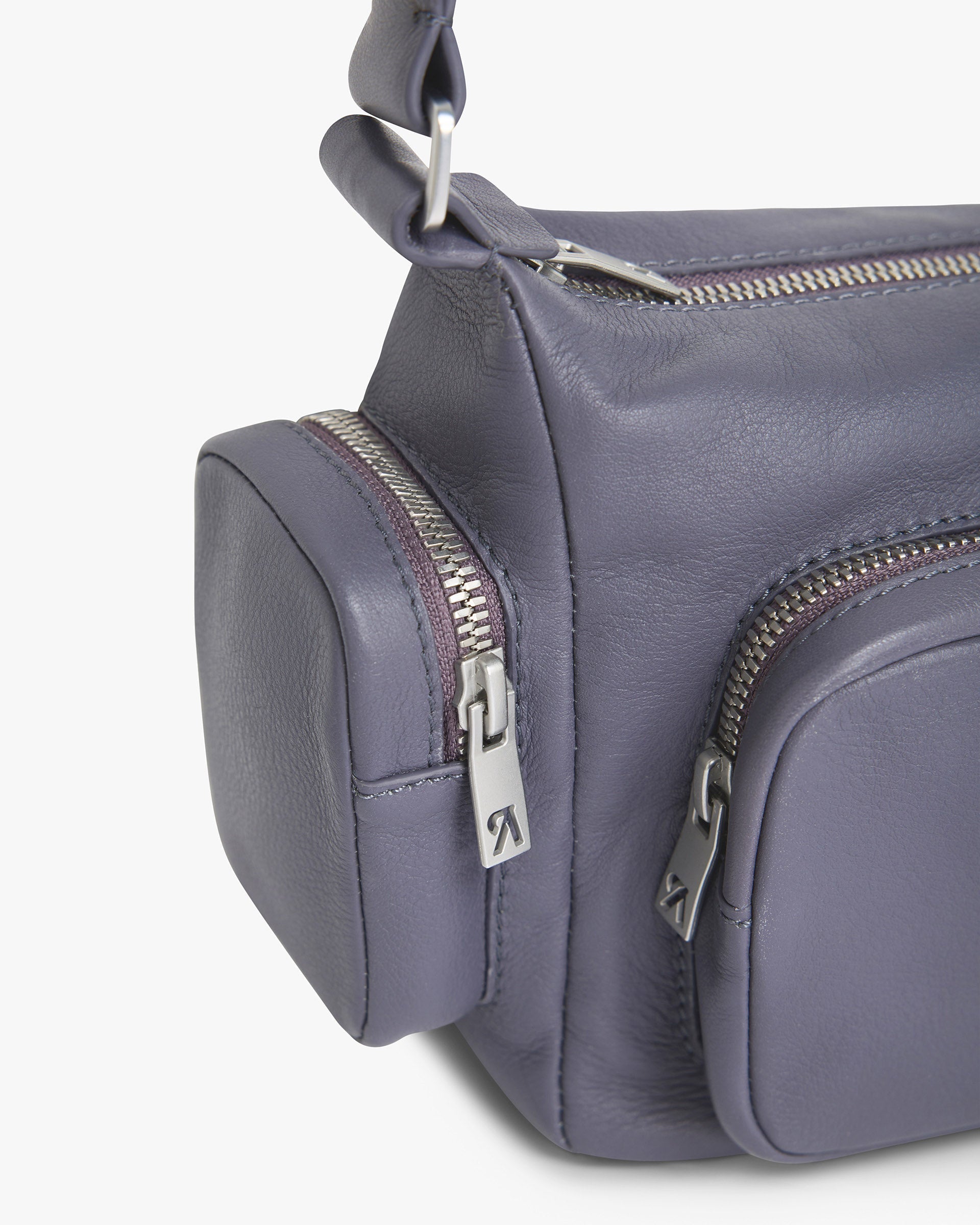 Back product image of a womens grey leather shoulder bag on a plain white background | Utility Shoulder Bag in Excalibur | Leather bag with zip fastening and shoulder strap | Womens SS25 Accessories | Represent Clo