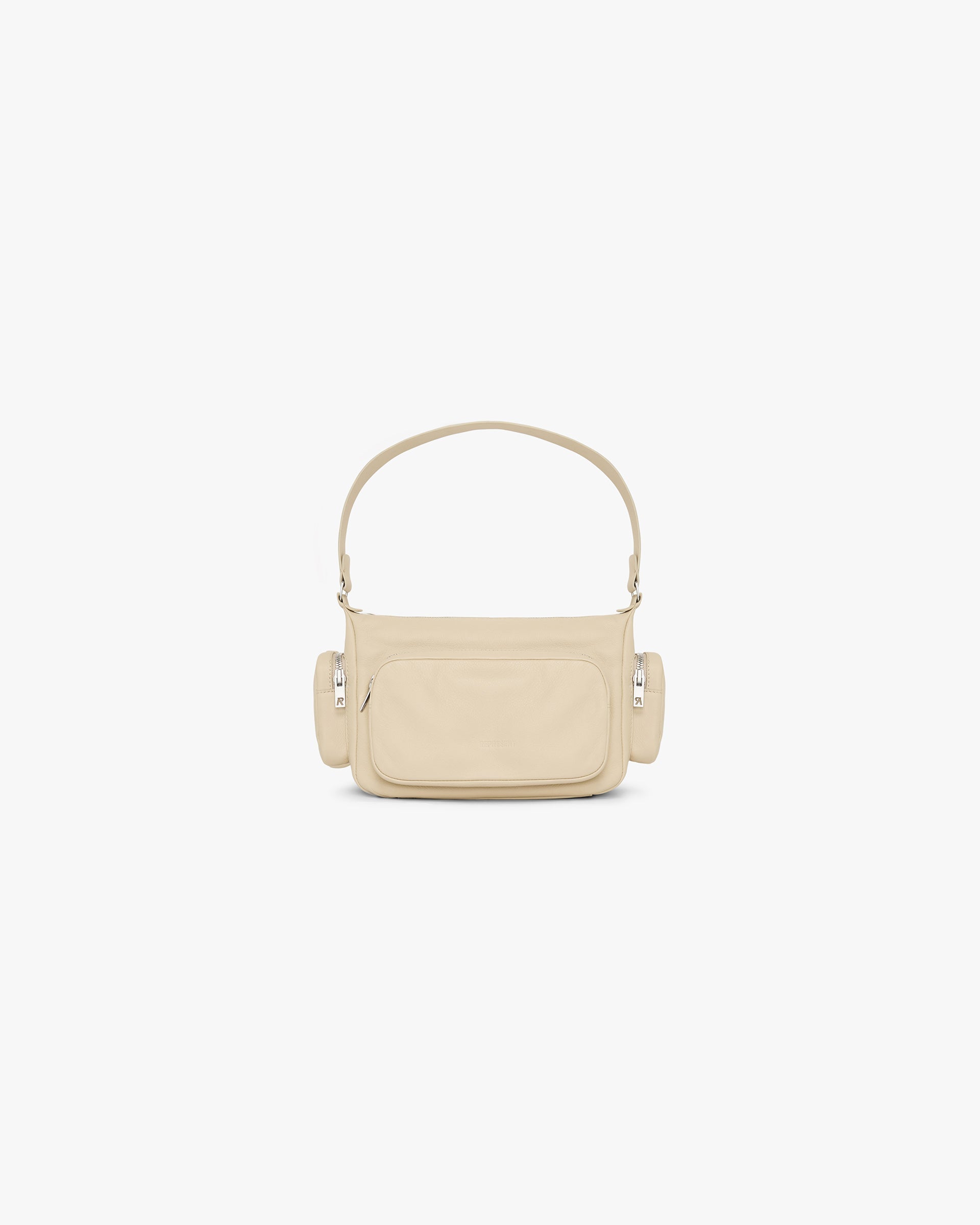 Front product image of a womens cream shoulder bag on a plain white background | Utility Shoulder Bag in Cream | Versatile shoulder bag with functional design | Womens SS25 Accessories | Represent Clo