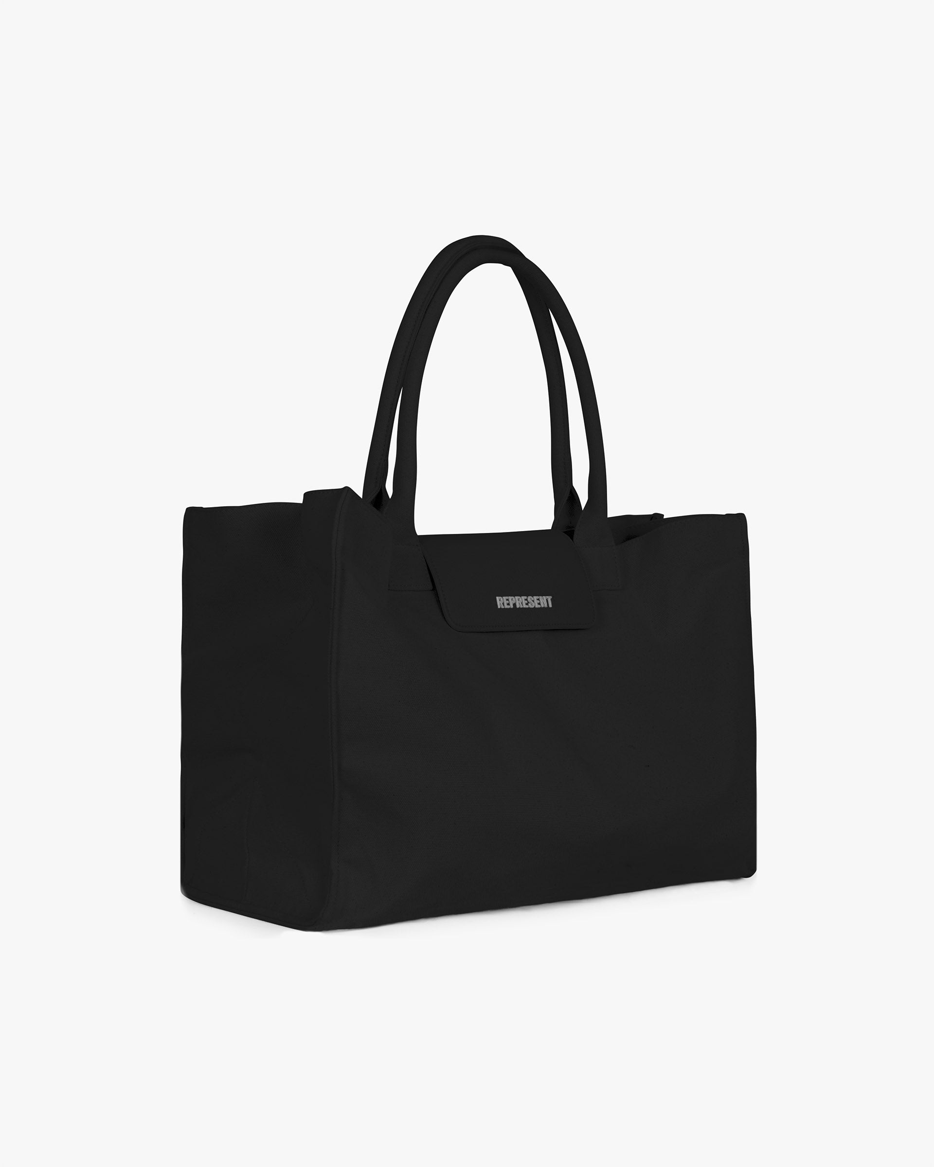Back product image of a mens black tote bag on a plain white background | Canvas Tote Bag in Jet Black | Lightweight structured tote bag with spacious compartment | SS25 Accessories | Represent Clo