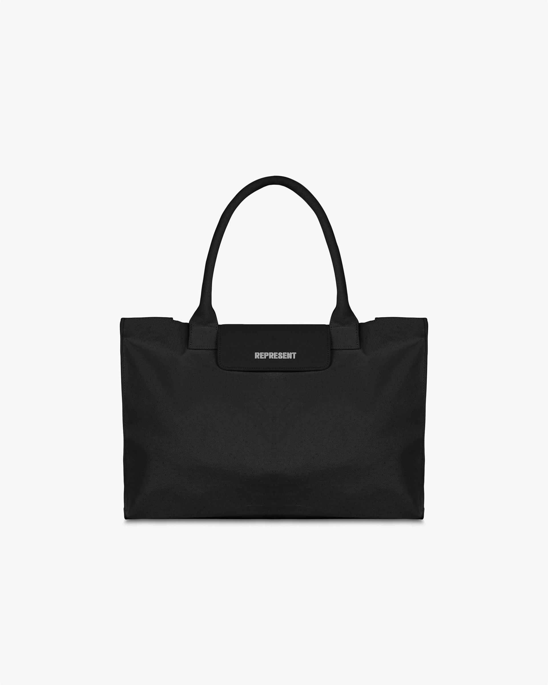 Front product image of a mens black tote bag on a plain white background | Canvas Tote Bag in Jet Black | Stylish canvas tote bag | SS25 Accessories | Represent Clo