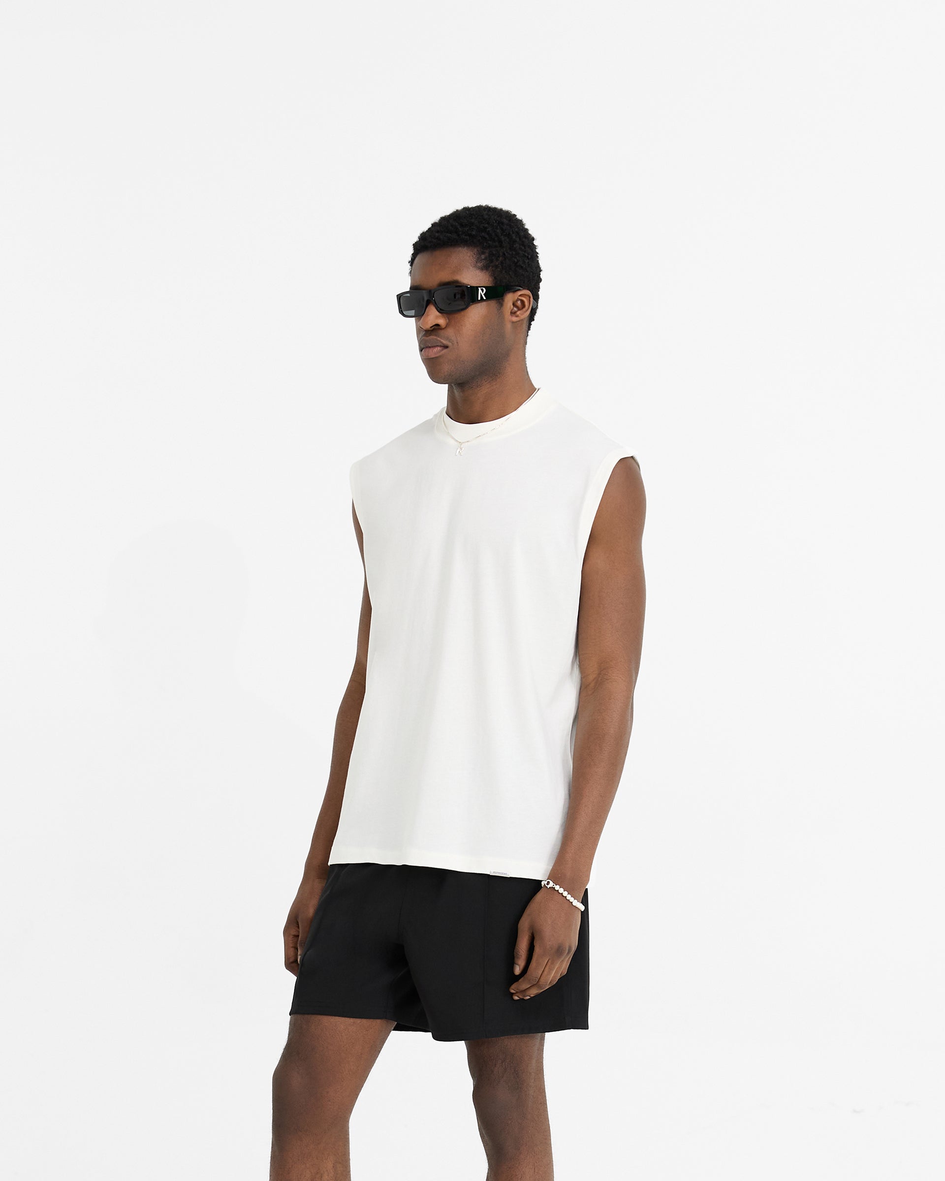 Back product image of a mens white tank on a plain white background | Initial Boxy Tank in Flat White | Boxy cropped oversized tank with embroidered back detail | Initial T-Shirts | Represent Clo