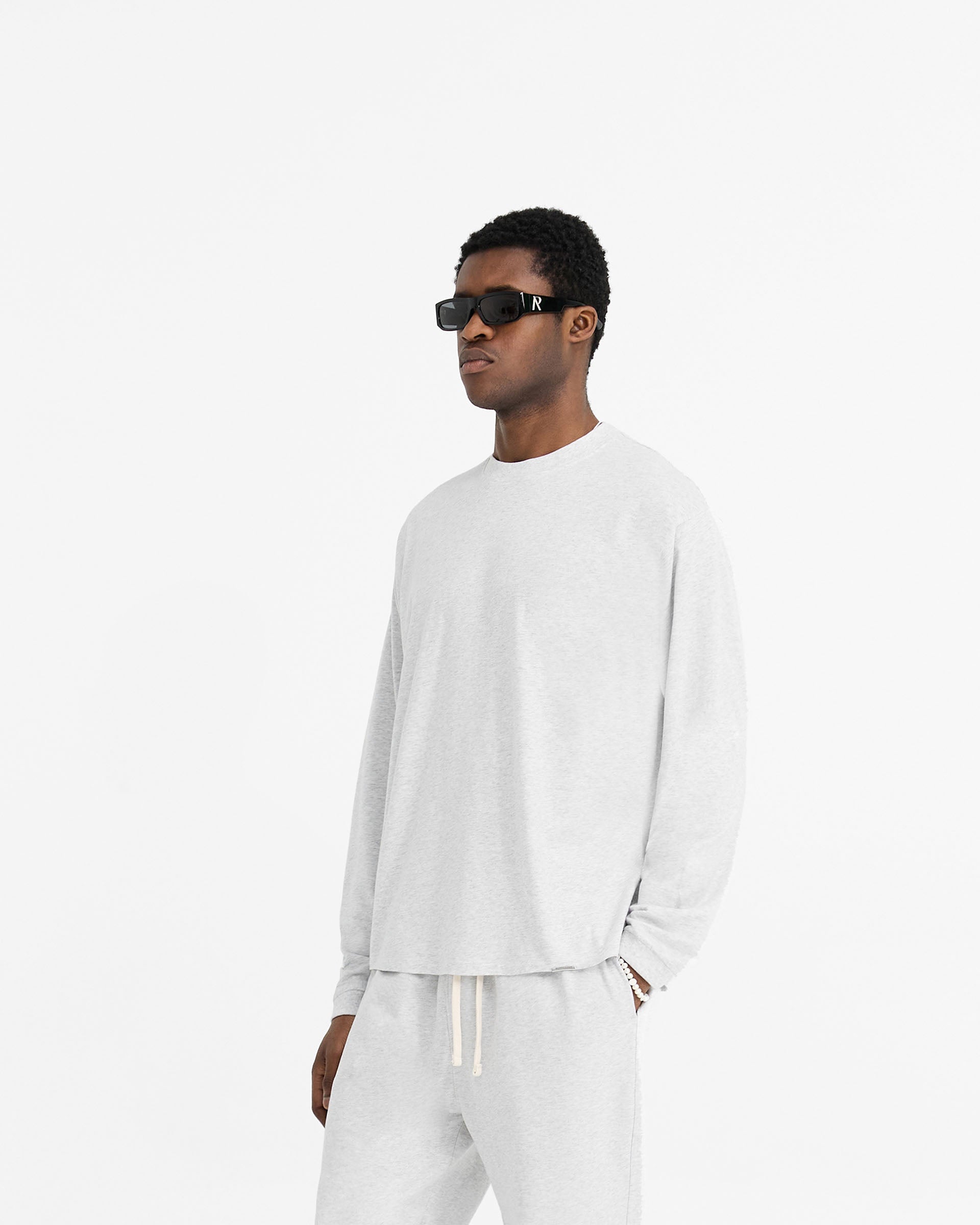 Back product image of a mens grey t-shirt on a plain white background | Initial Long Sleeve T-Shirt in Ice Grey Marl | Long sleeve t-shirt with embroidered details | Initial T-Shirts | Represent Clo