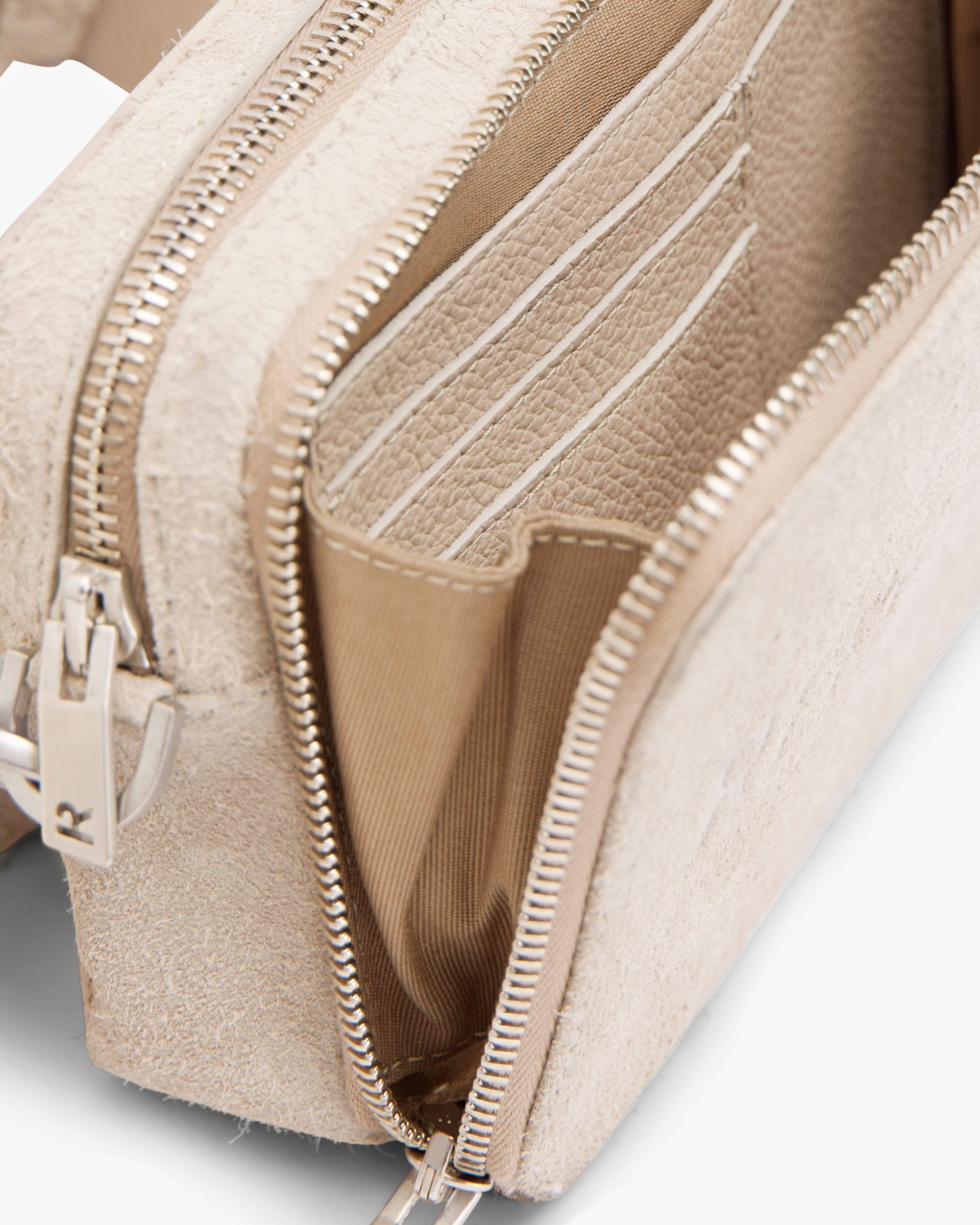 Back product image of a mens beige camera bag on a plain white background | Represent Hairy Suede Camera Bag in Cashmere | Suede camera bag with adjustable strap | SS24 Accessories | Represent Clo