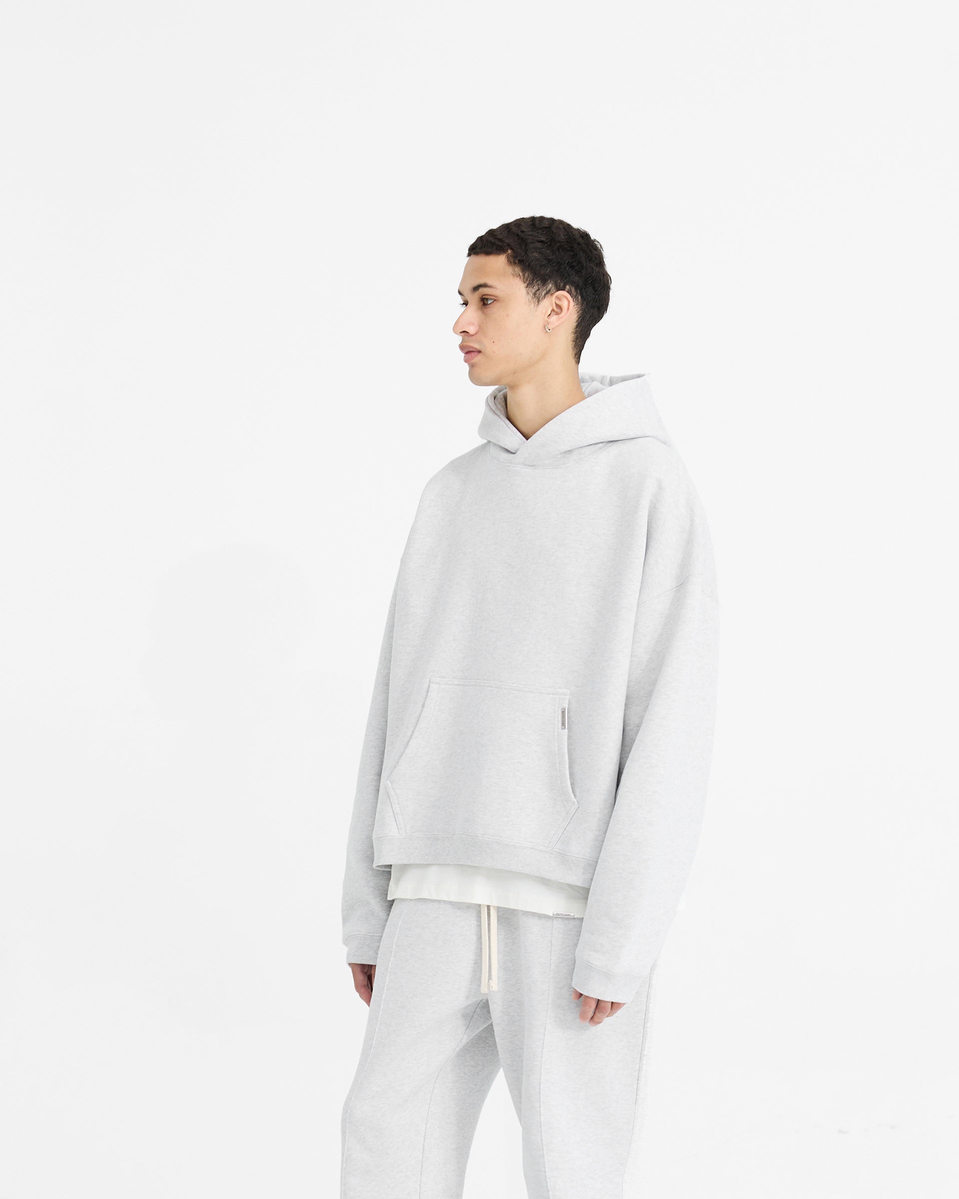 Back product image of a mens grey hoodie on a plain white background | Initial Boxy Hoodie in Ice Grey Marl | Boxy fit hoodie with dropped shoulders | Initial Hoodies | Represent Clo