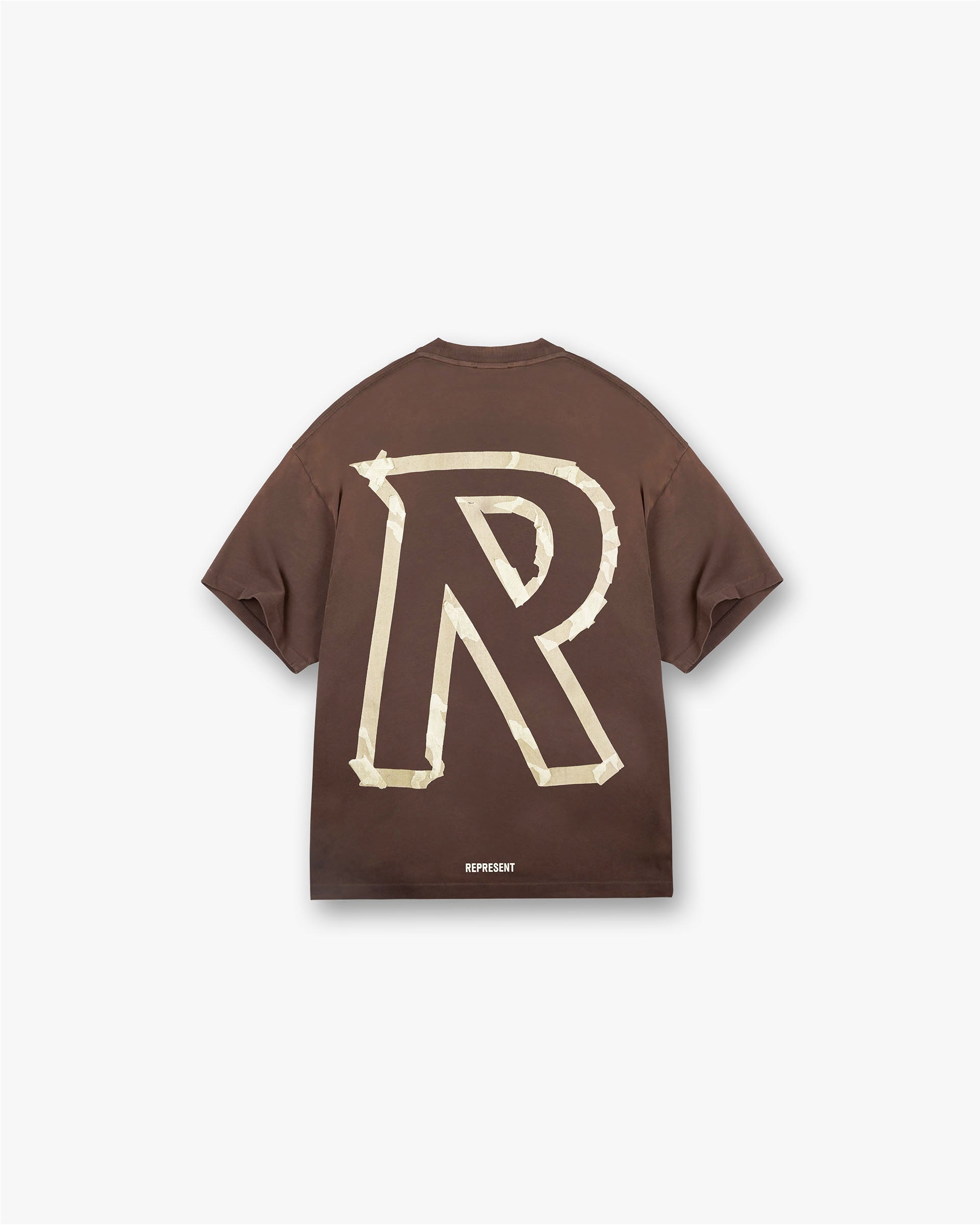 Back product image of a mens brown t-shirt on a plain white background | Masking Tape Initial T-Shirt in Cedar | T-shirt with 3D masking tape effect | FW24 T-Shirts | Represent Clo