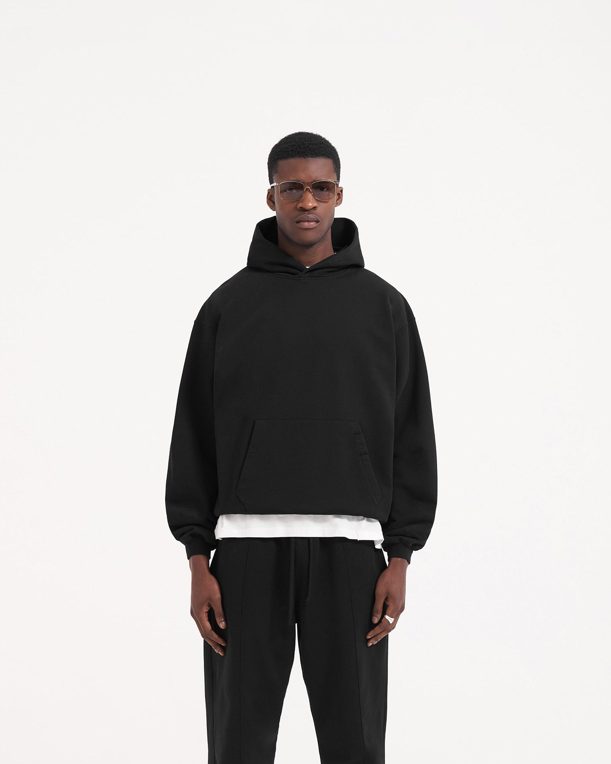 Back product image of a mens black hoodie on a plain white background | Initial Hoodie in Jet Black | Black hoodie with embroidered logo and kangaroo pocket | Initial Hoodies | Represent Clo