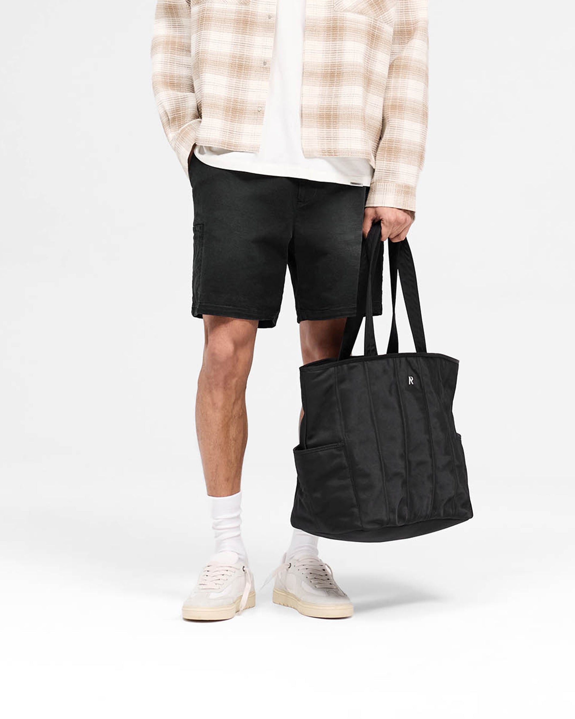 Back product image of mens black shorts on a plain white background | Season Cargo Short in Jet Black | Cargo shorts with welt pockets and YKK fly | SS25 Shorts | Represent Clo