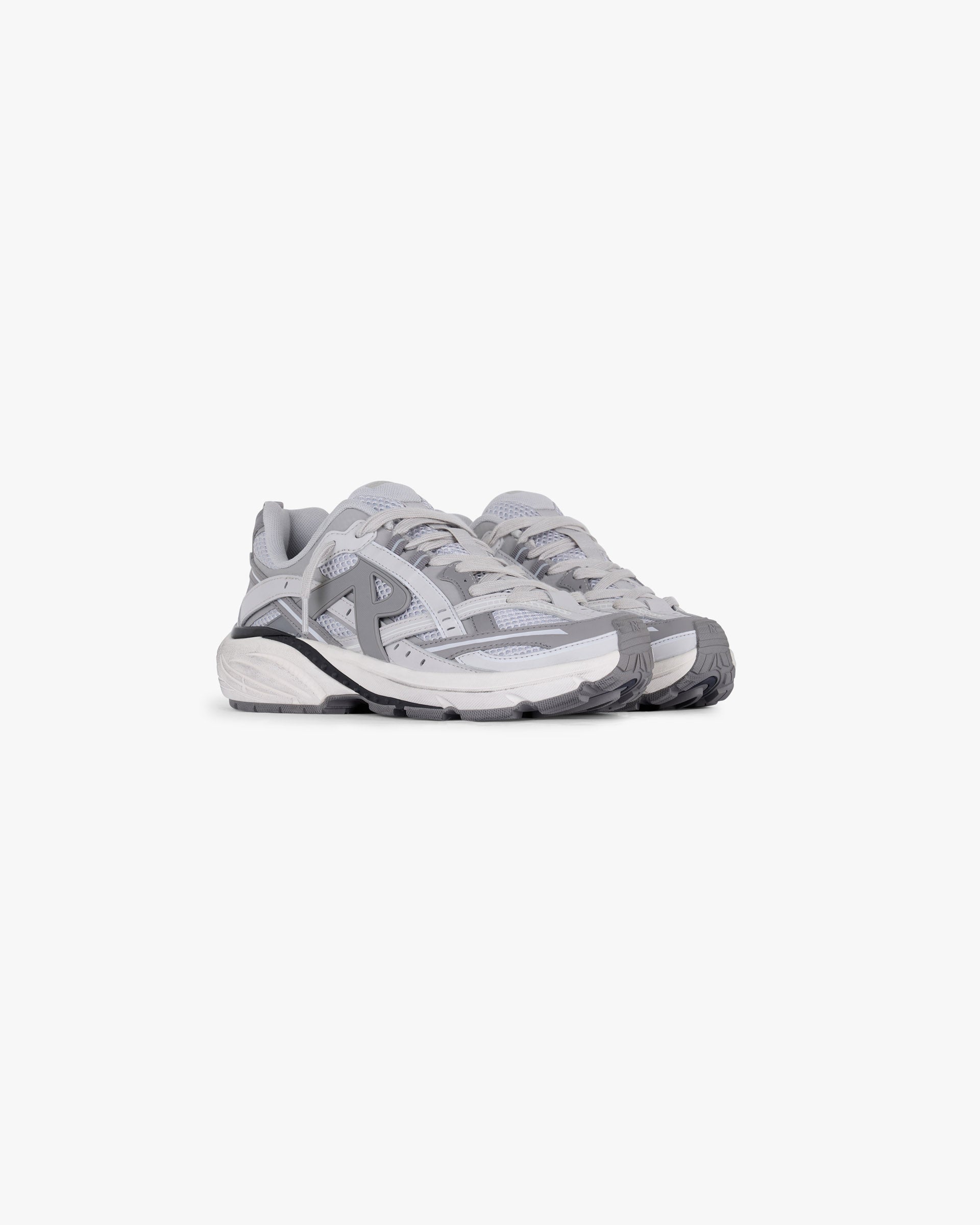 Back product image of mens grey sneakers on a plain white background | Storm Runner in Ultimate Grey | Sneakers with vapour grey and light grey leather overlays | SS25 Footwear | Represent Clo