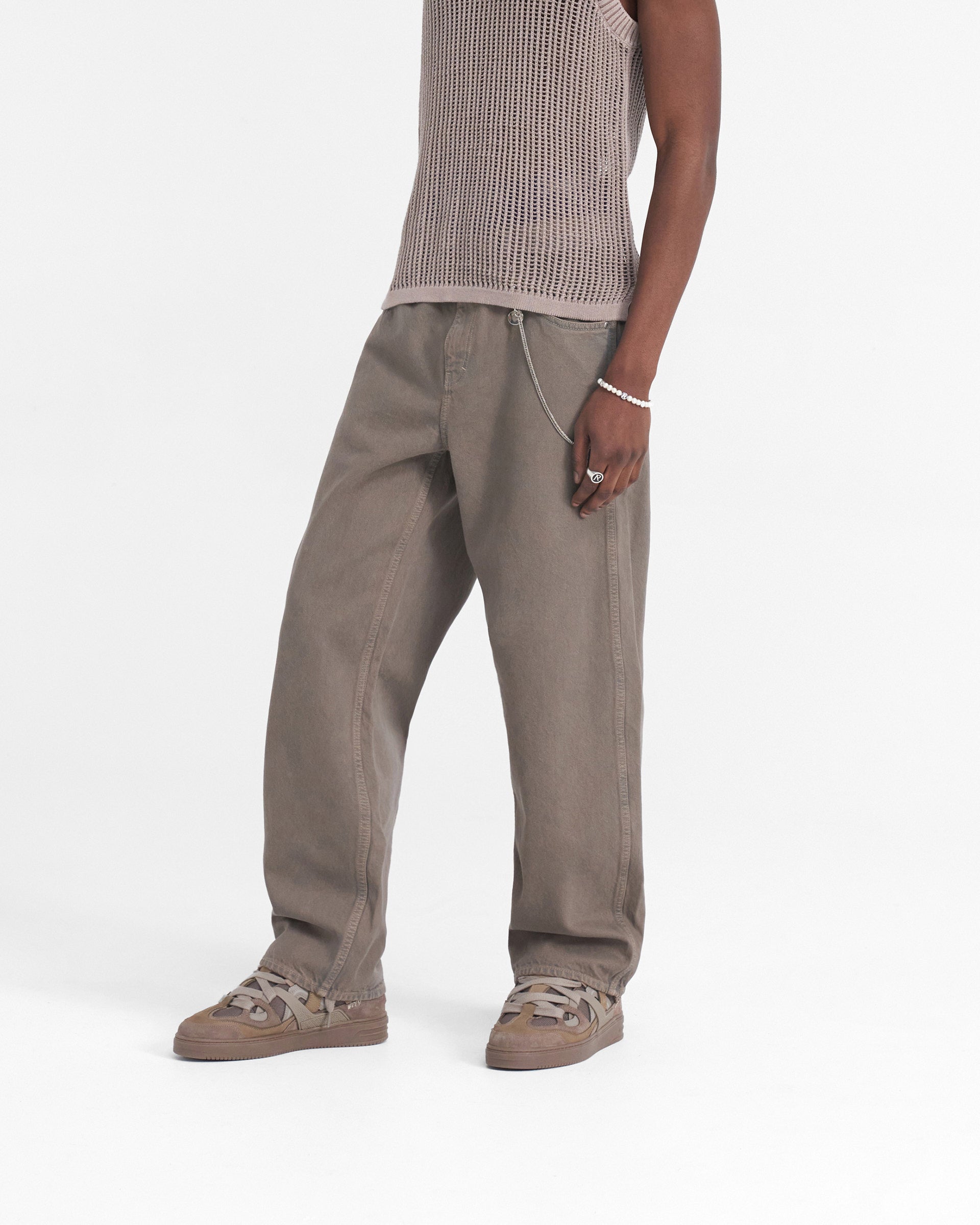 Back product image of mens grey denim jeans on a plain white background | R3 Baggy Denim in Rock | Baggy fit jeans with heavy wash and branded trims | SS24 Denim | Represent Clo