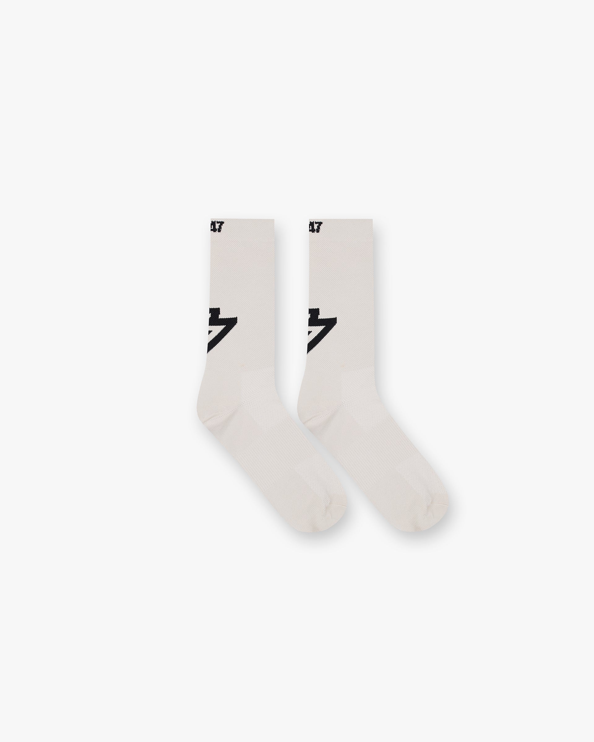 Front product image of mens cream socks on a plain white background | 247 X Puma Race Socks in Cream | Luxury race socks with a stepped hem design | 247 Accessories | Represent Clo