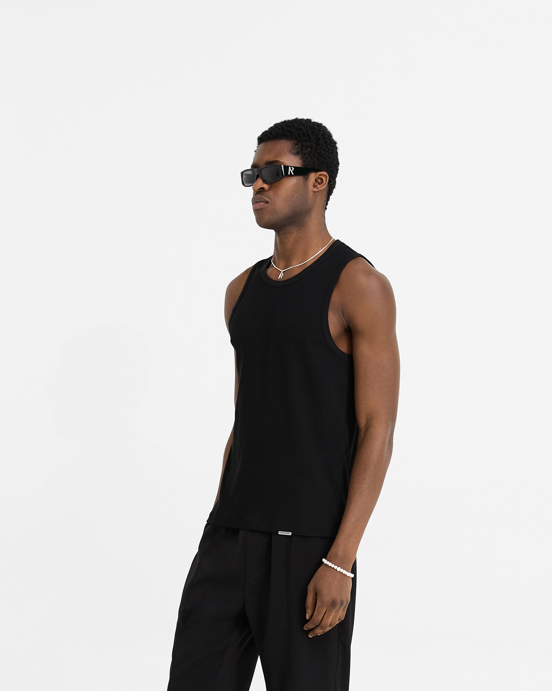 Back product image of a mens black vest on a plain white background | Initial Rib Vest in Black | Rib vest with neck and armhole binding details | Initial T-Shirts | Represent Clo