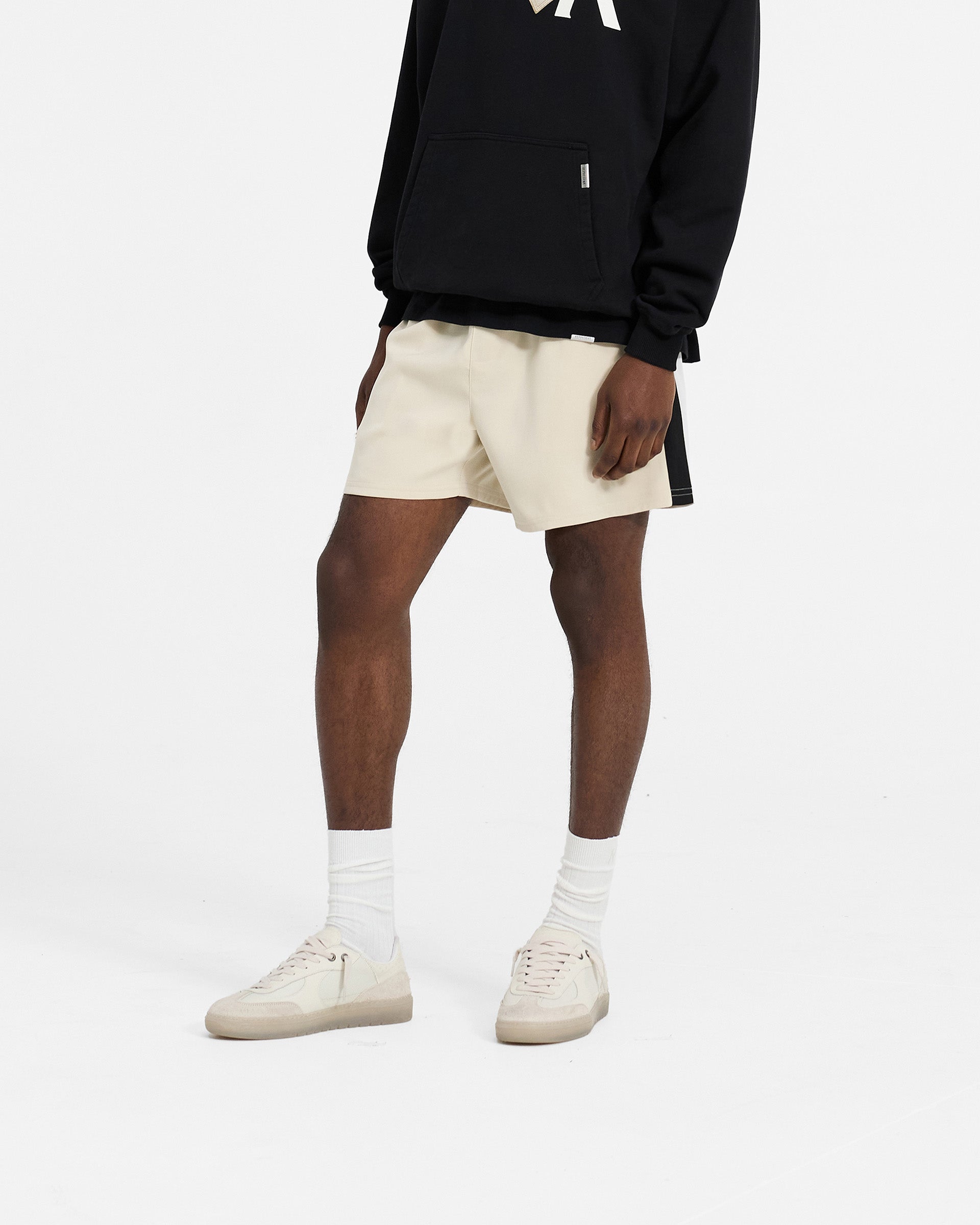 Back product image of mens white shorts on a plain white background | Track Short in Antique White | Relaxed fit shorts with contrast panels and embroidered branding | SC24 Shorts | Represent Clo