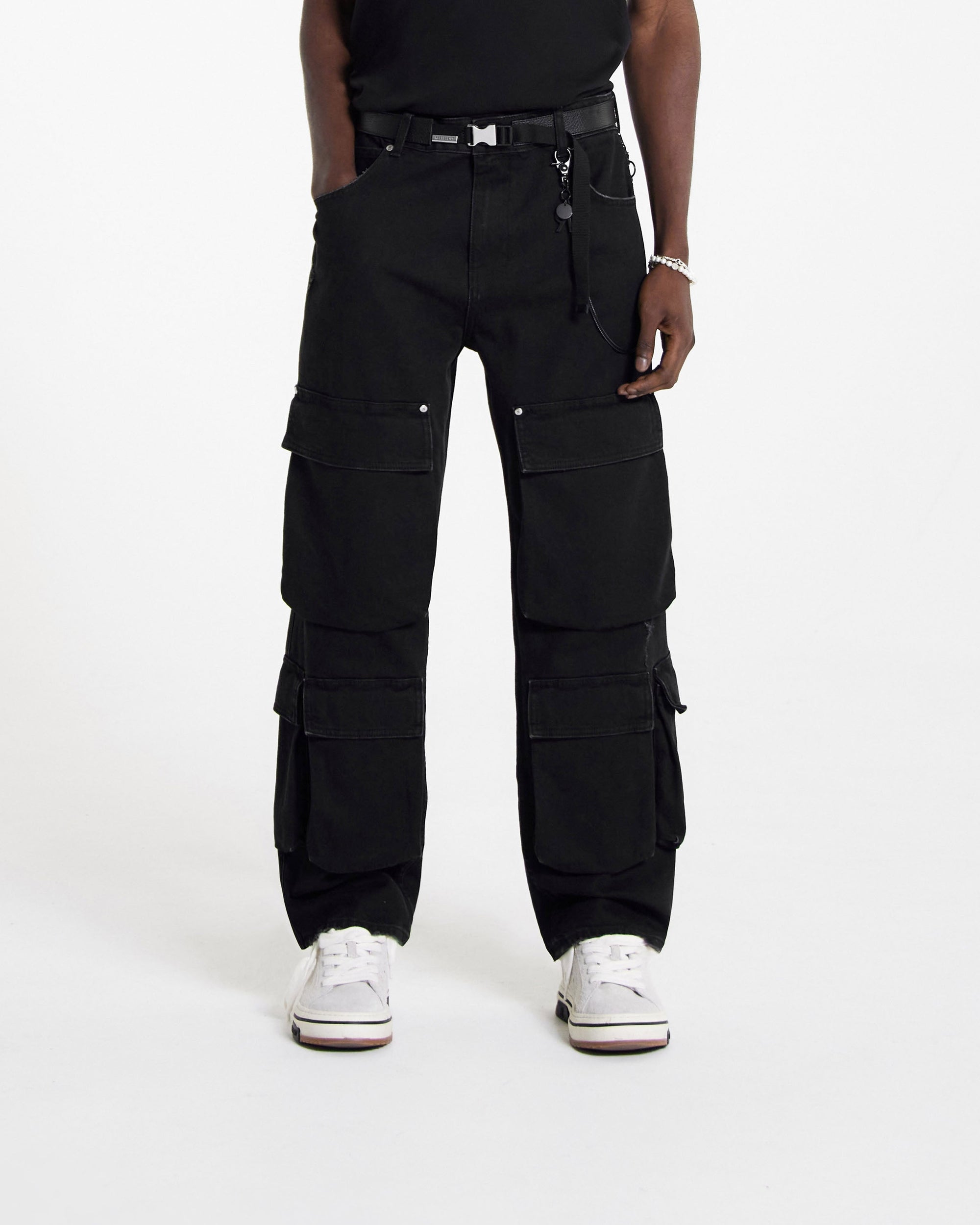 Back product image of mens black denim on a plain white background | R3Ca Cargo Denim in Black | Baggy fit cargo pants with multiple pockets | SS24 Denim | Represent Clo