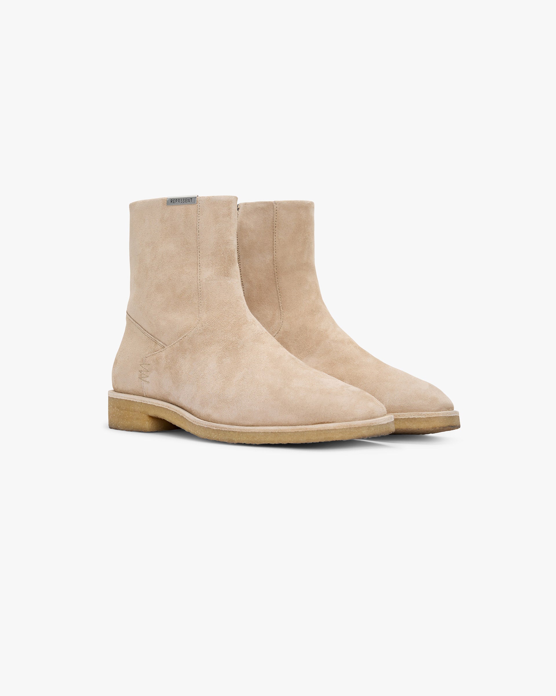 Back product image of a mens beige Chelsea boot on a plain white background | Crepe Chelsea Boot in Sand | Soft suede boot with 100% natural crepe outsole | SS25 Footwear | Represent Clo