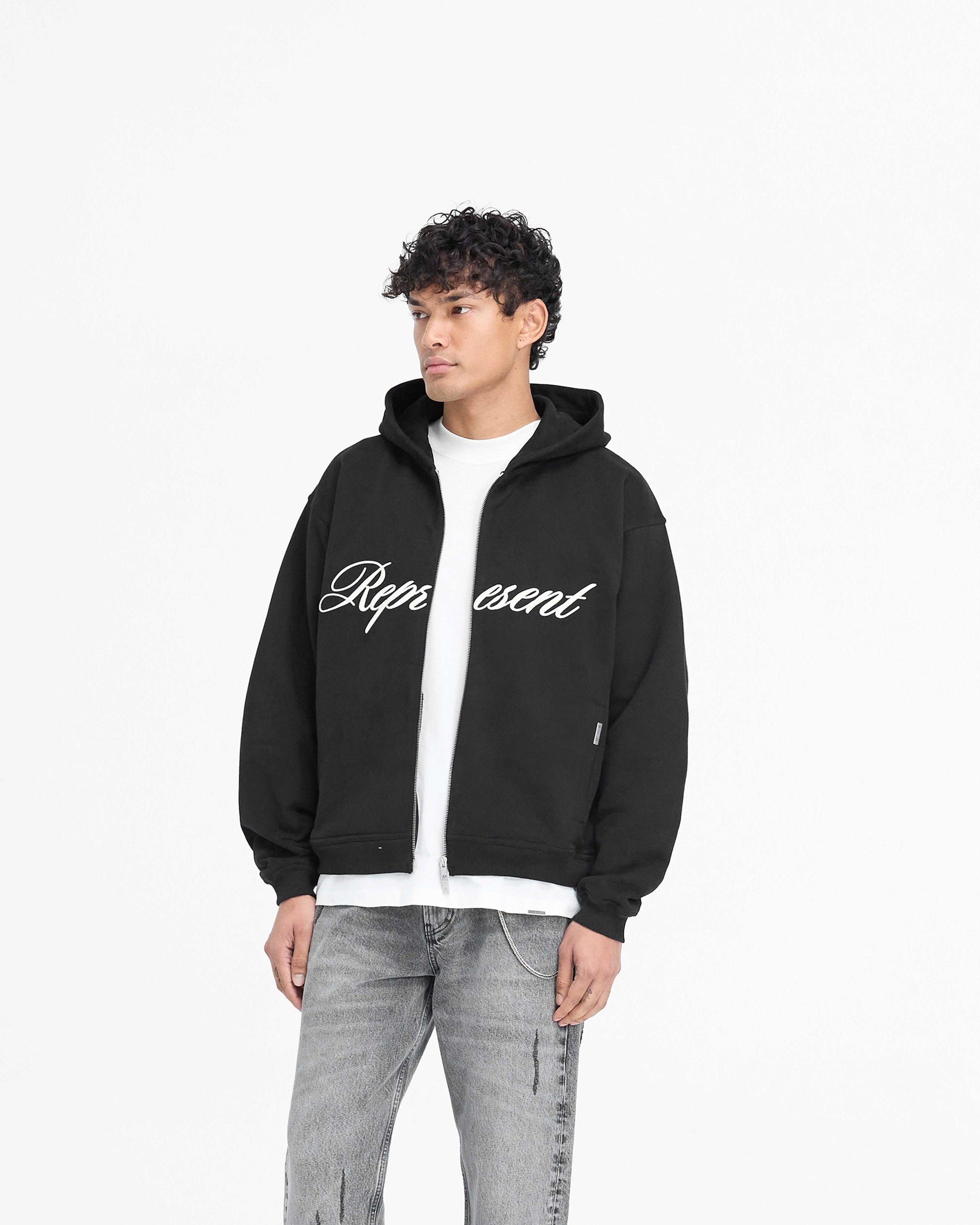 Back product image of a mens black zip hoodie on a plain white background | Script Logo Zip Hoodie in Black | Oversized hoodie with RiRi double zip and high build embroidery | PRE SS25 Hoodies | Represent Clo