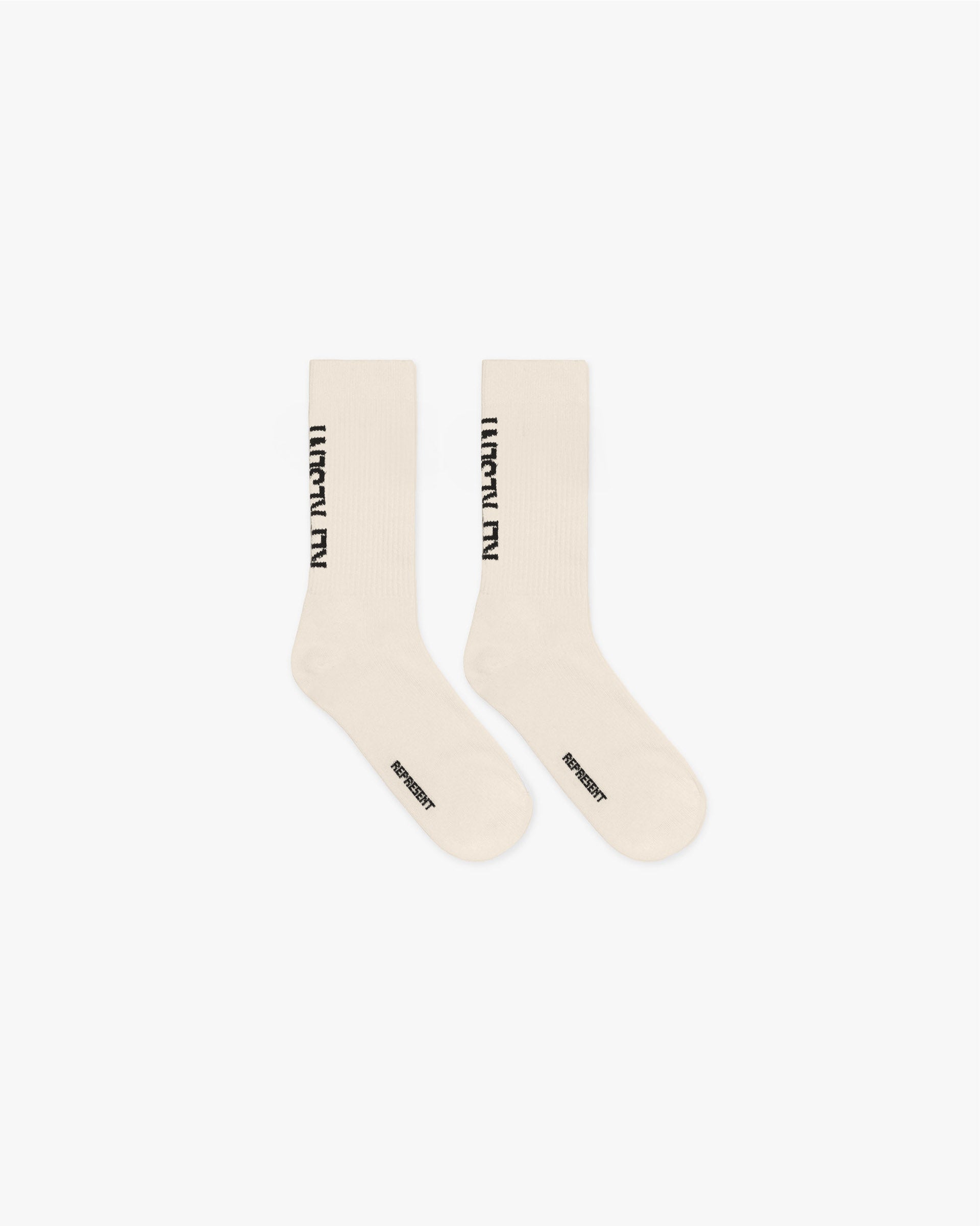 Front product image of mens white socks on a plain white background | Represent Logo Socks in Antique White | Accessories with represent logo | SS25 Accessories | Represent Clo