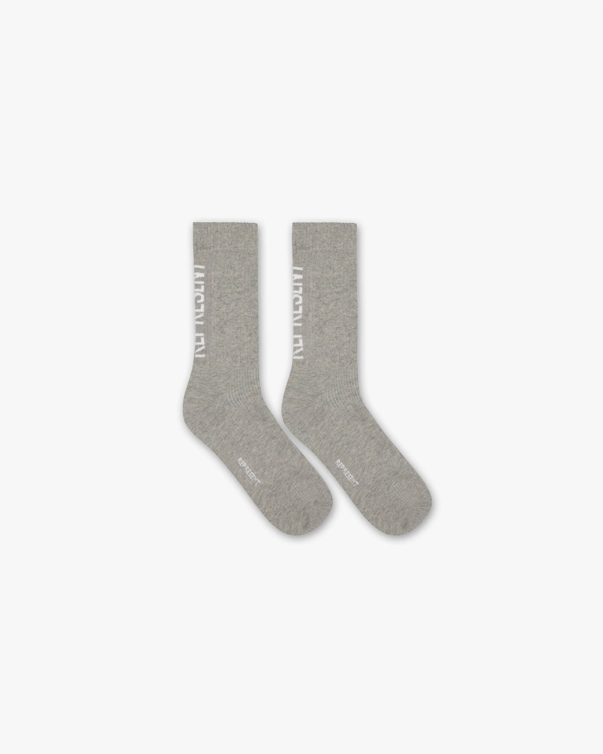 Front product image of mens grey socks on a plain white background | Represent Logo Socks in Ice Grey Marl | Cotton socks with oversized fit | SS25 Accessories | Represent Clo