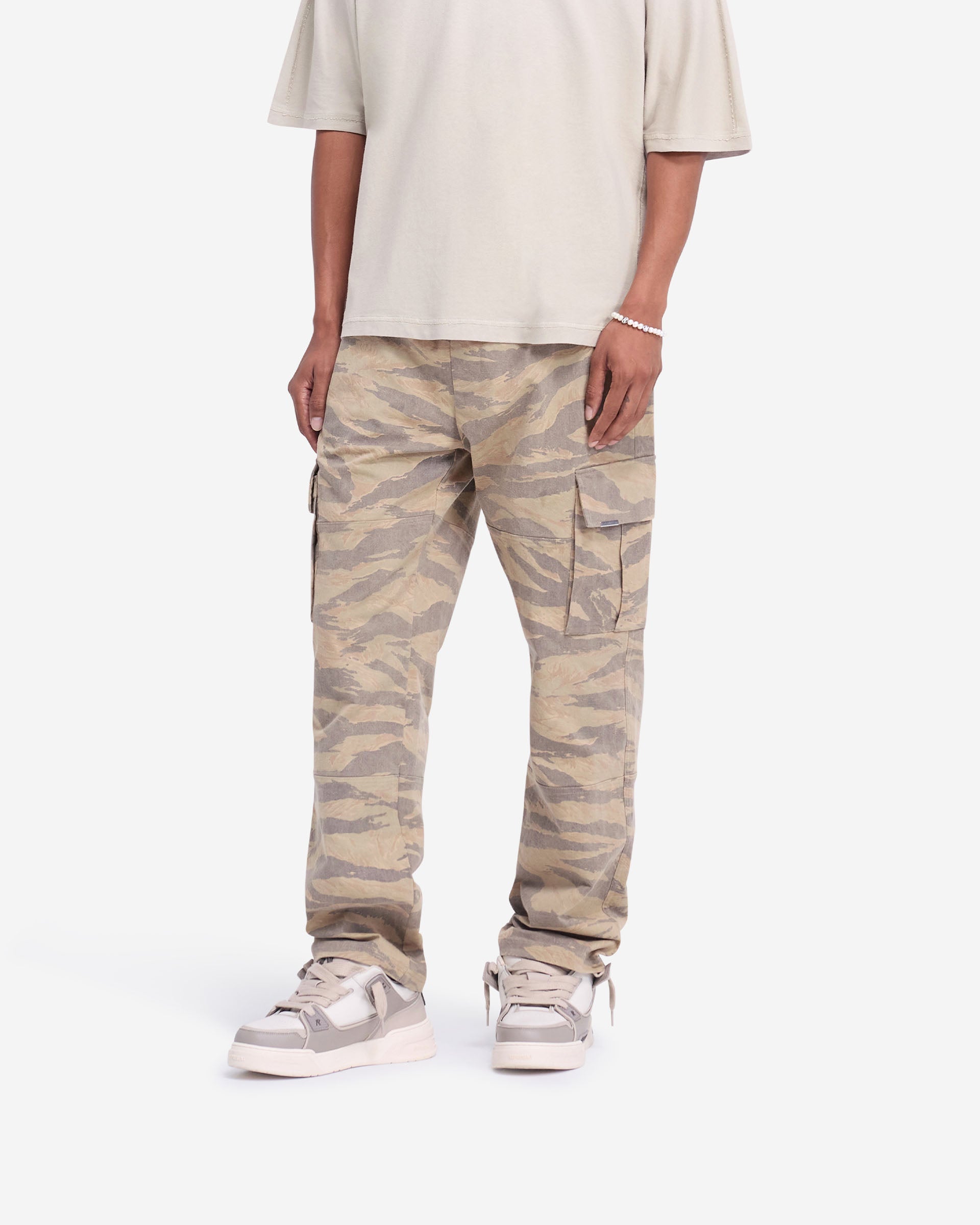 Back product image of mens camo pants on a plain white background | Cargo Pant in Camo | Camo pants with elasticated waistband and flap pockets | FW24 Pants | Represent Clo
