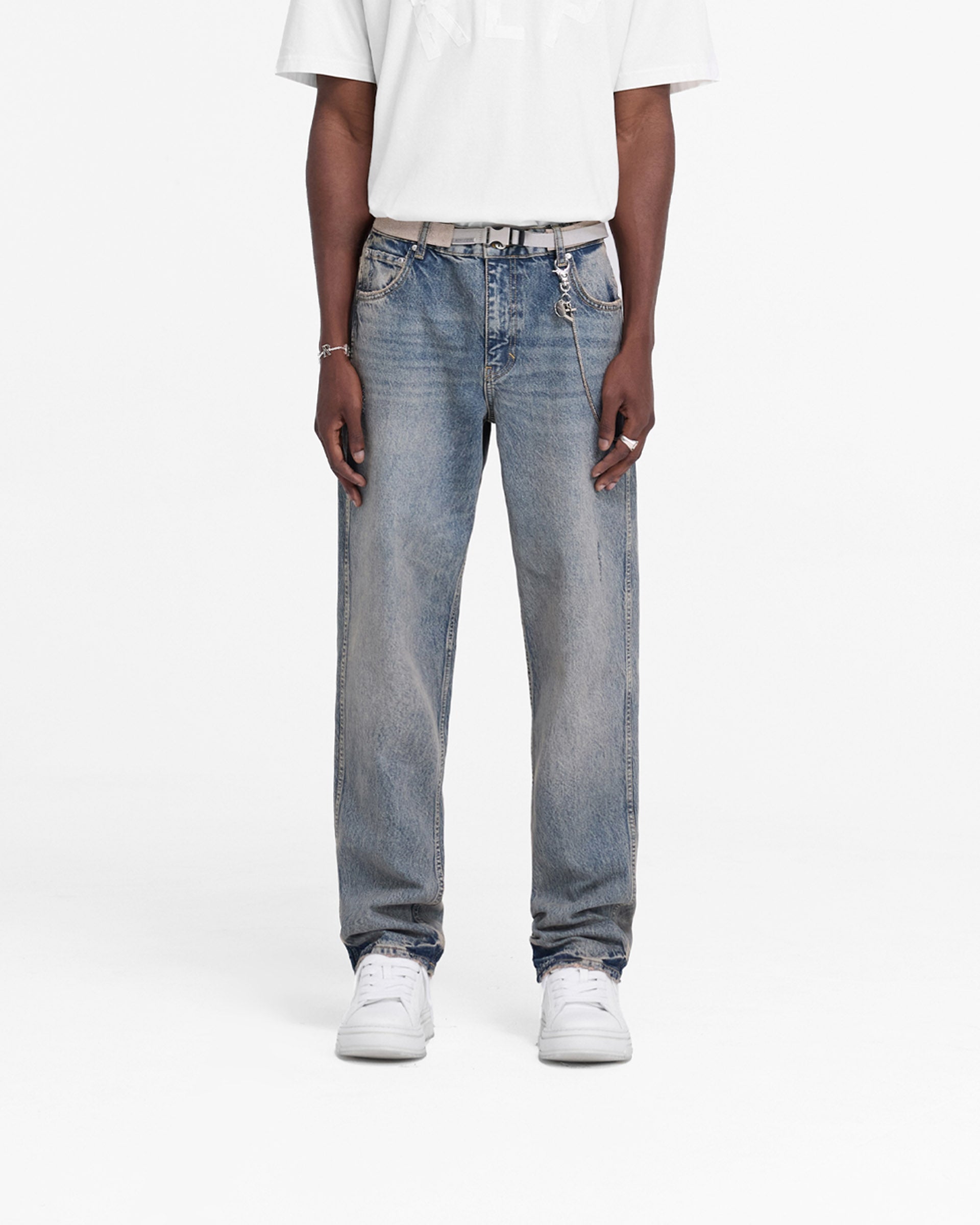 Back product image of mens blue denim jeans on a plain white background | R2 Straight Leg Denim in Mid Blue | Straight leg jeans with embroidered initial and metal hardware | FW24 Denim | Represent Clo