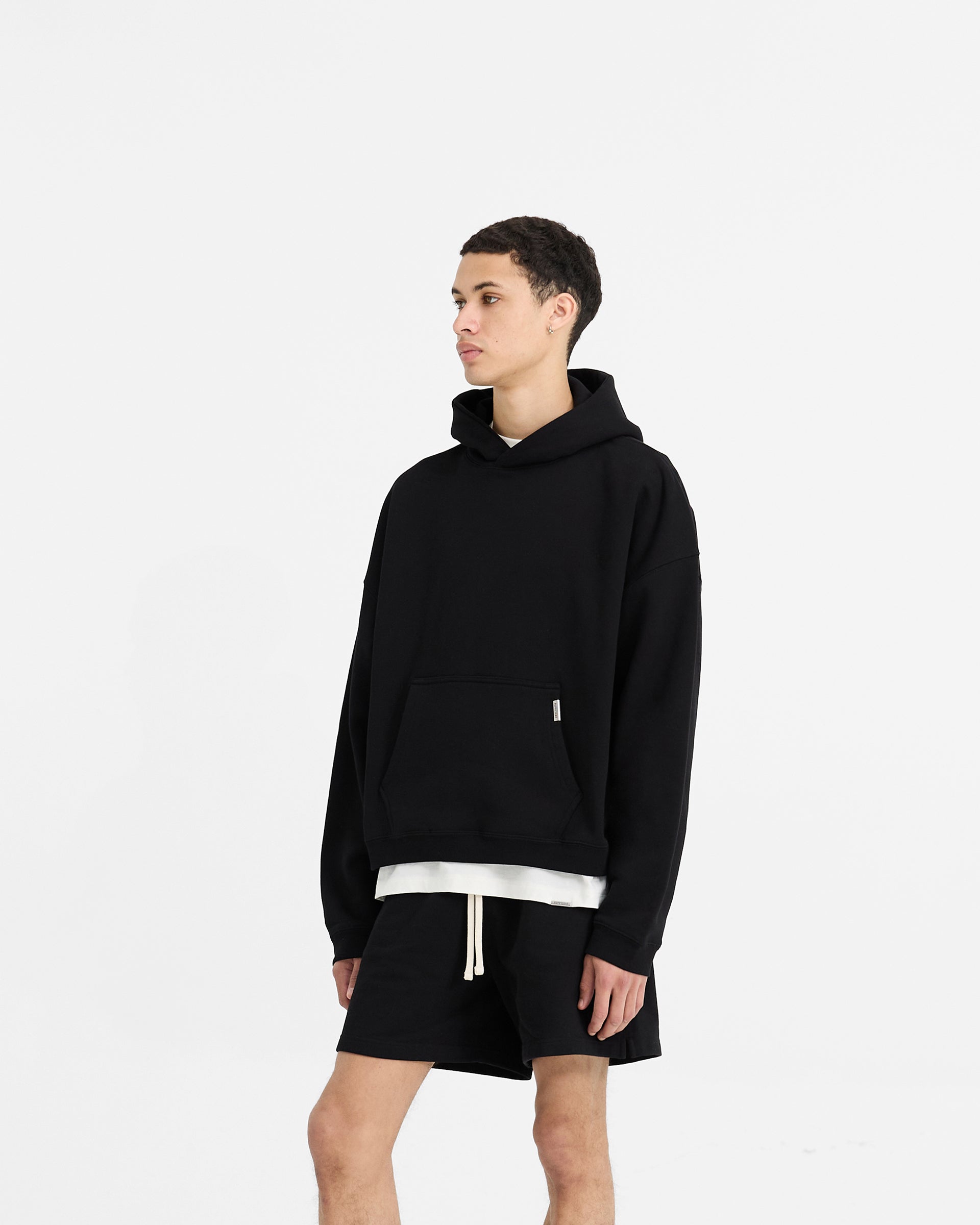 Back product image of a mens black hoodie on a plain white background | Initial Boxy Hoodie in Black | Oversized boxy fit hoodie with dropped shoulders | Initial Hoodies | Represent Clo