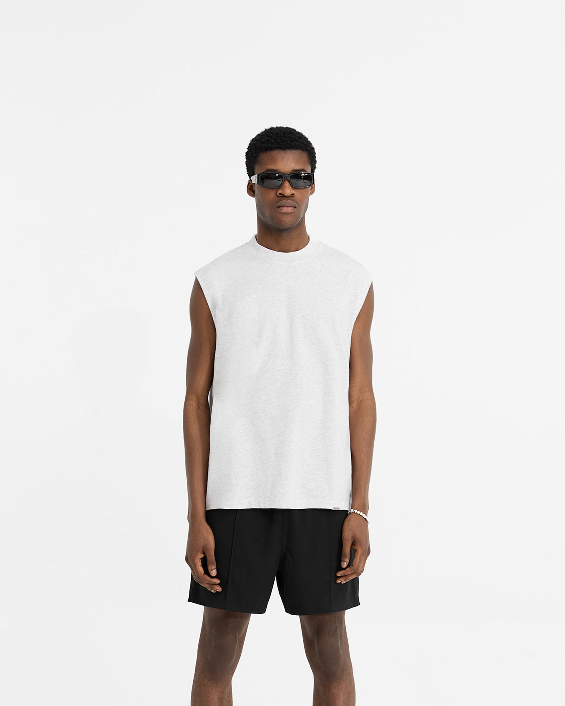 Man wearing a grey tank top on a plain white background | Initial Boxy Tank in Ice Grey Marl | Oversized tank with boxy cropped fit | Initial T-Shirts | Represent Clo