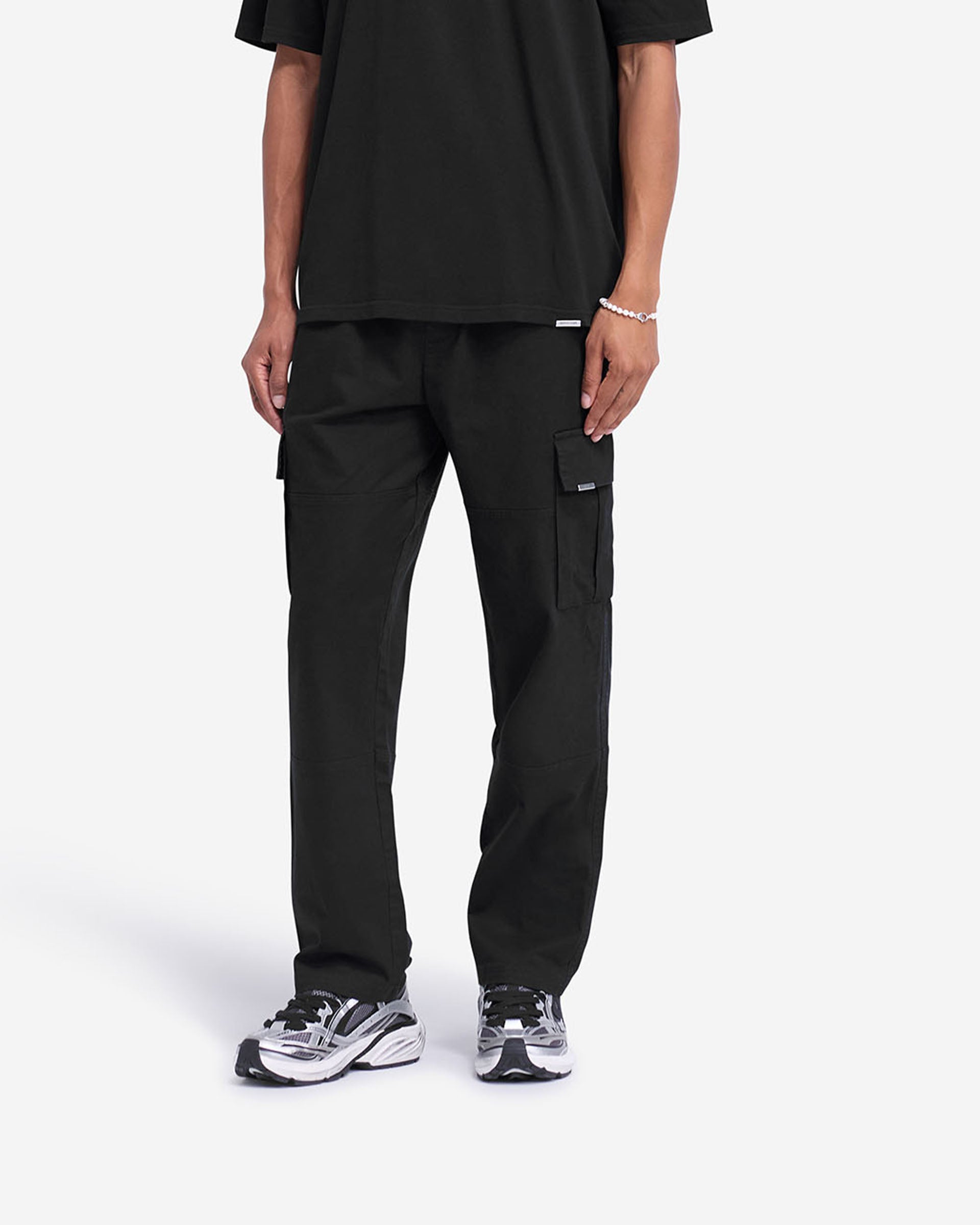Back product image of mens black cargo pants on a plain white background | Cargo Pant in Black | Regular fit cargo pants with elasticated waistband and flap pockets | FW24 Pants | Represent Clo
